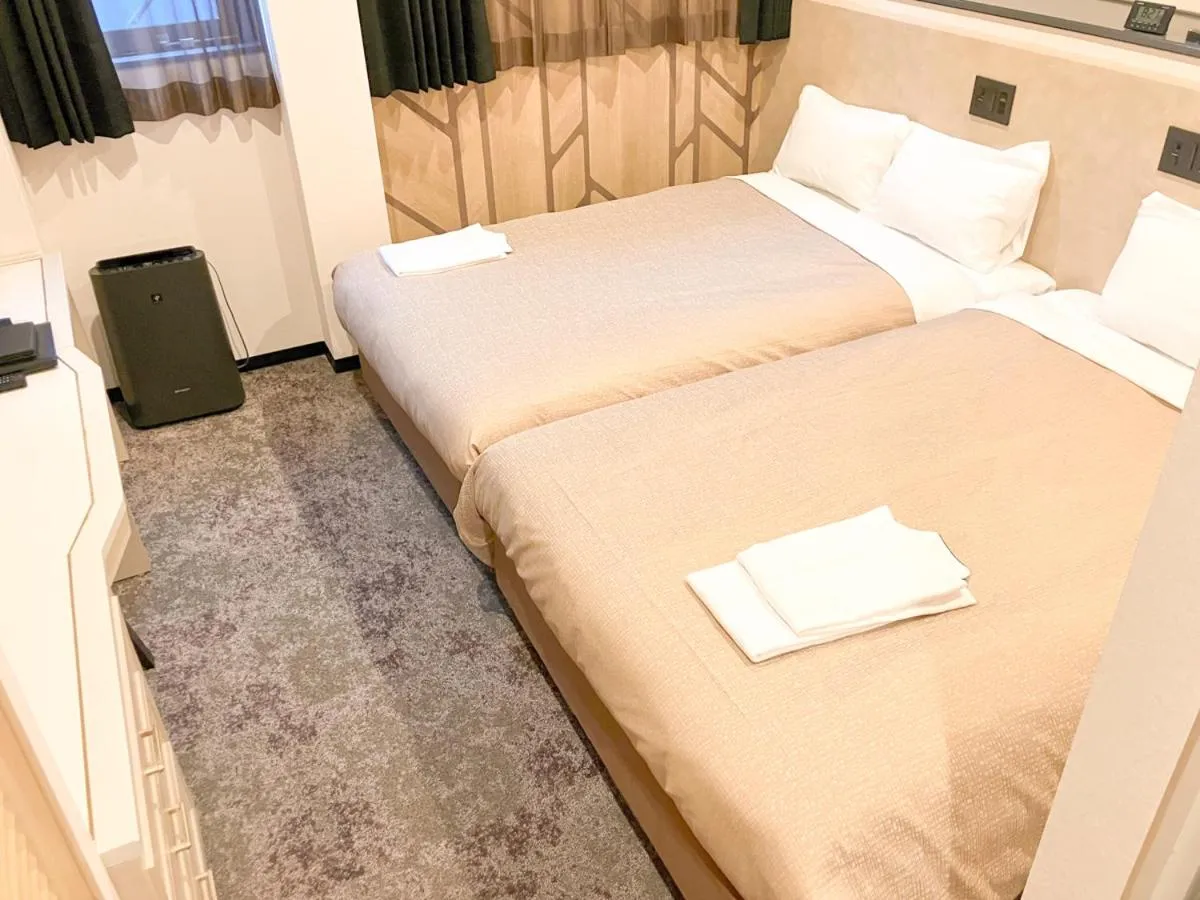 Bed in Hotel LiVEMAX Tendo