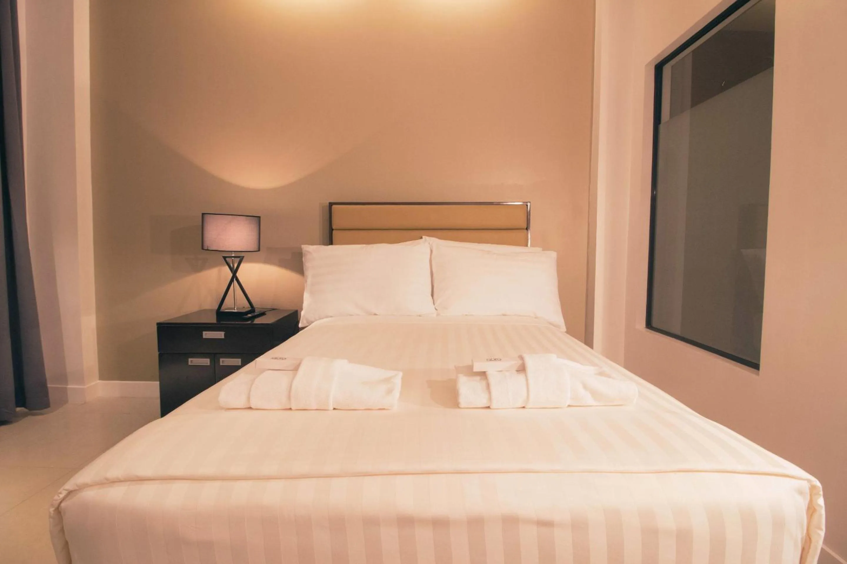 Bed in Aura Condotel