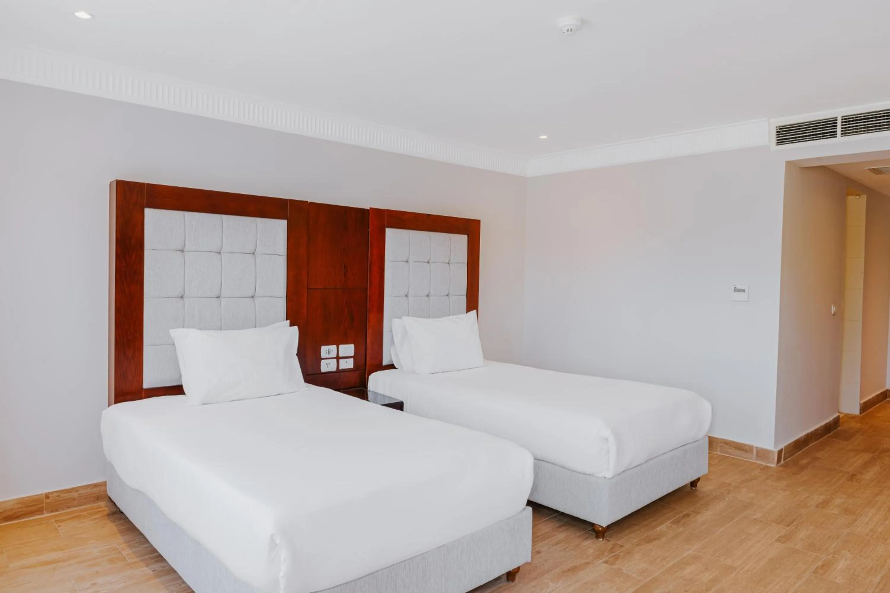 Photo of the whole room, Bed in Diamond Beach by Pearl Resorts