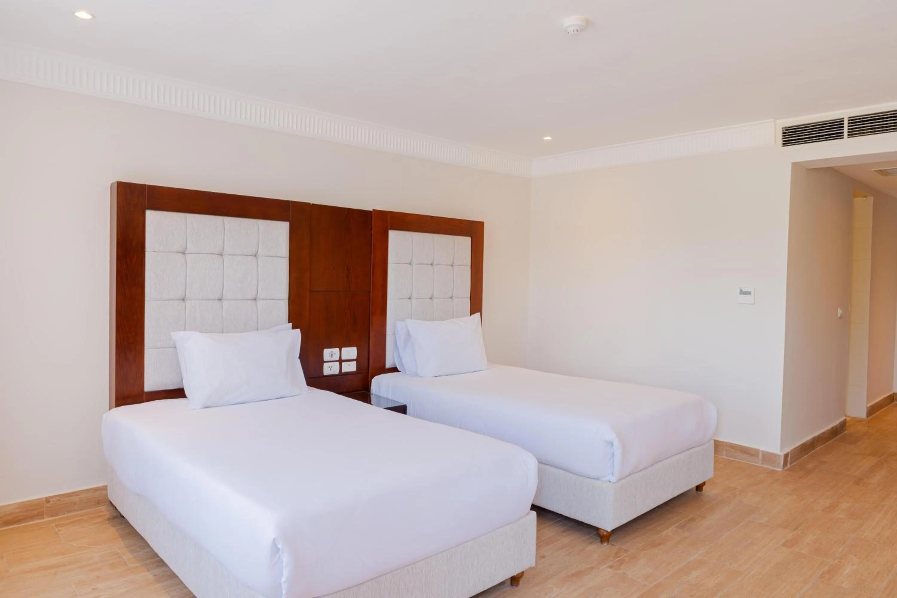 Photo of the whole room, Bed in Diamond Beach by Pearl Resorts