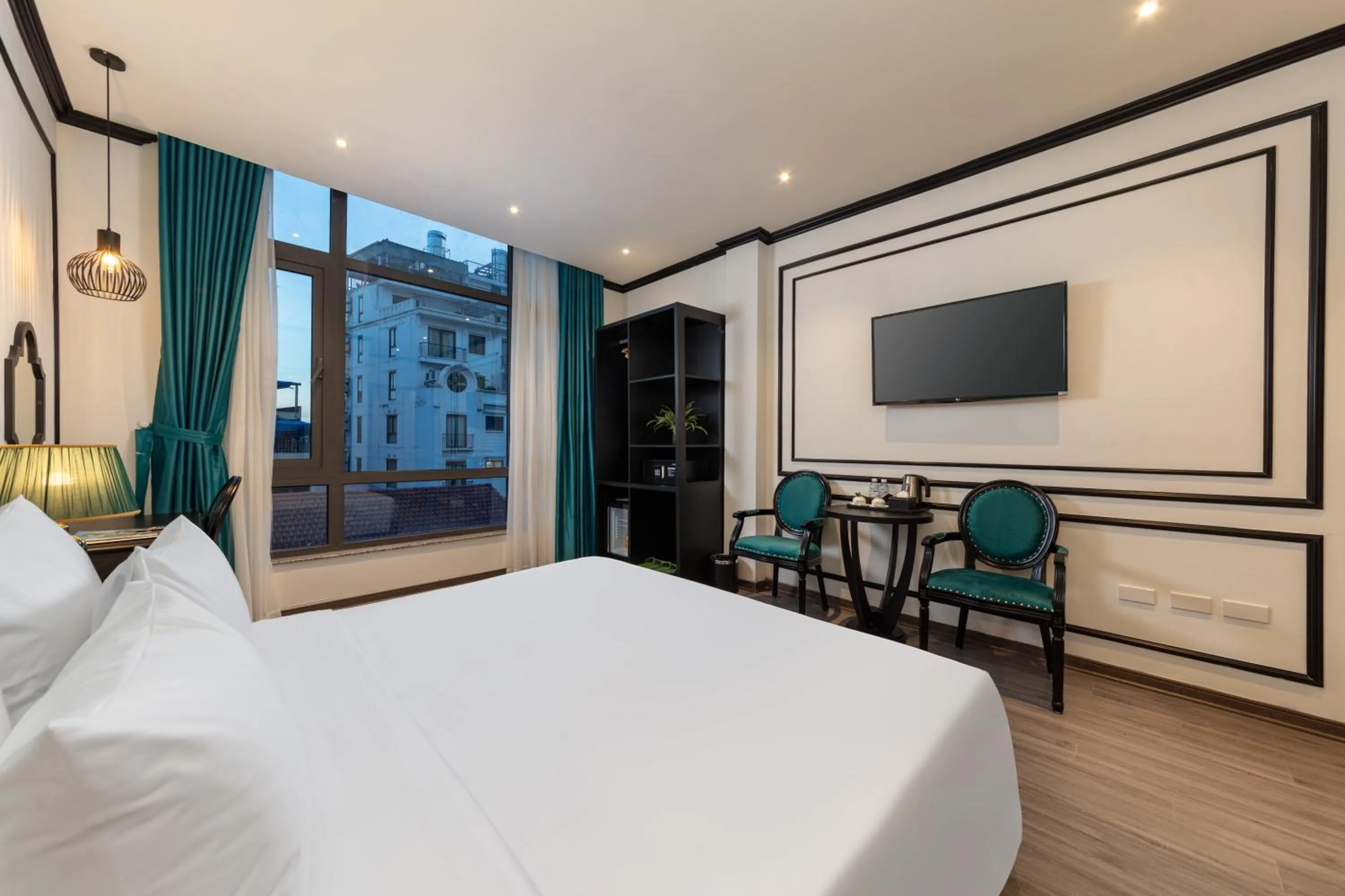 Communal lounge/ TV room, Bed in Azen Lakeside Hotel & Travel