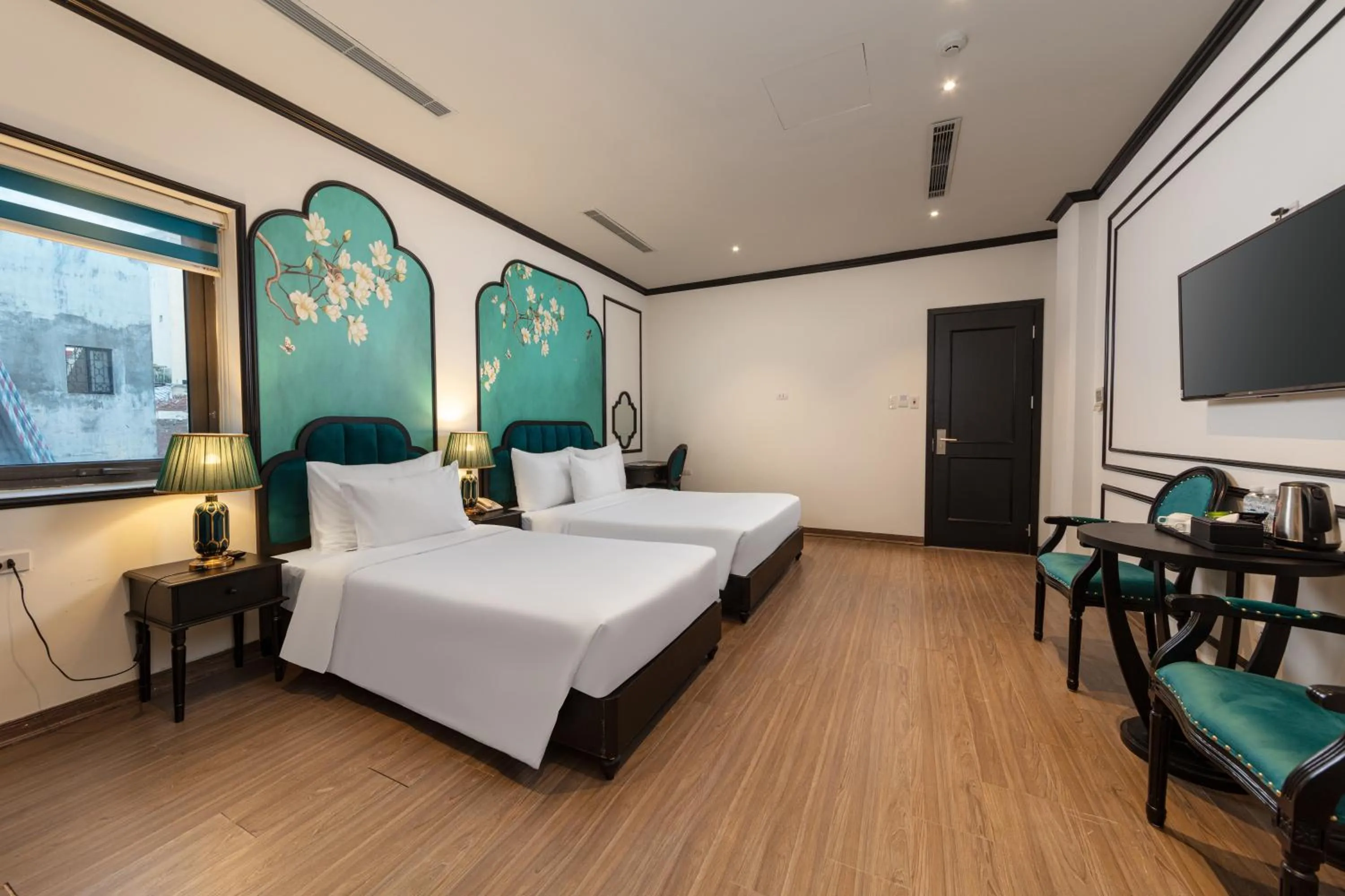 Communal lounge/ TV room, Bed in Azen Lakeside Hotel & Travel