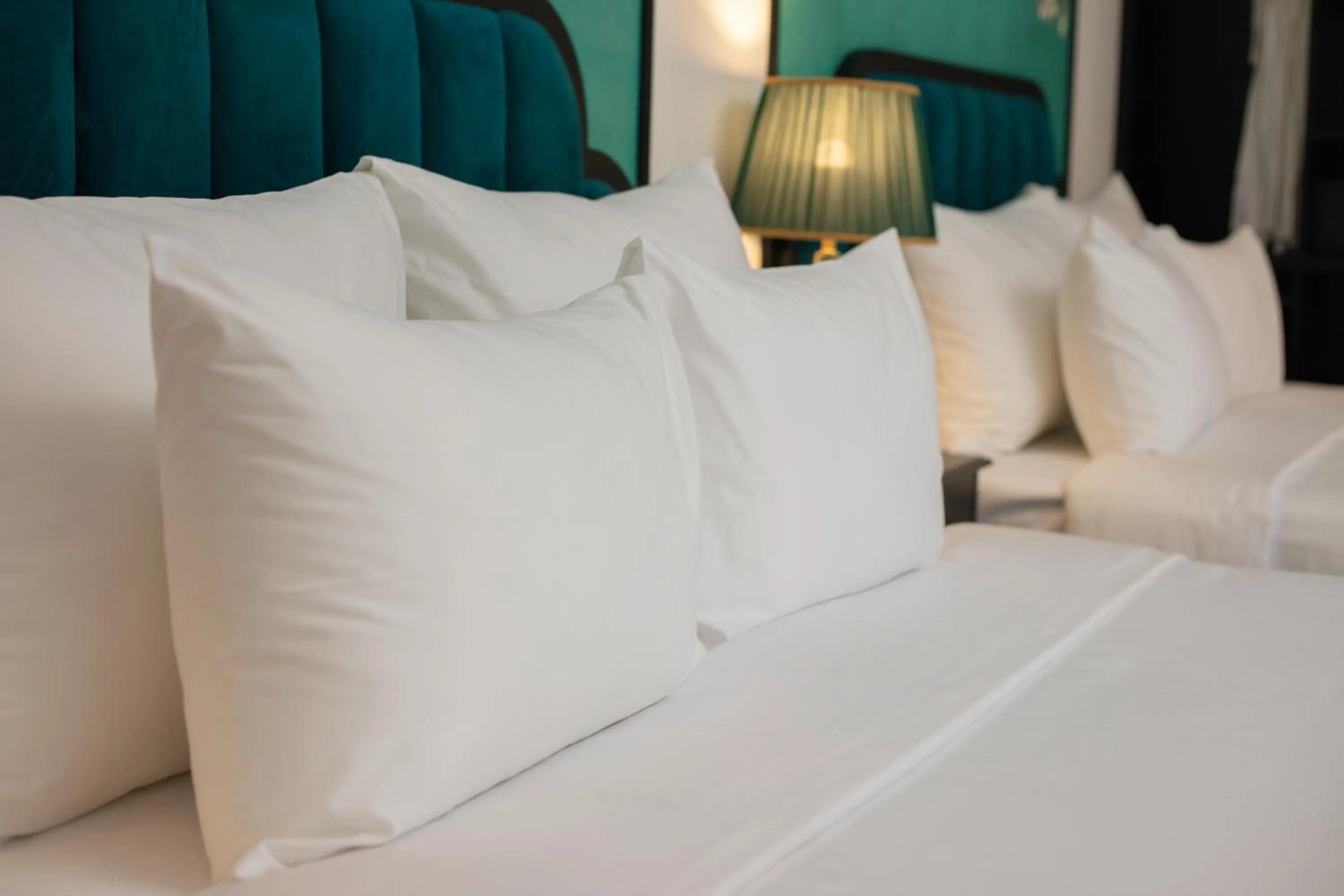 Bed in Azen Lakeside Hotel & Travel