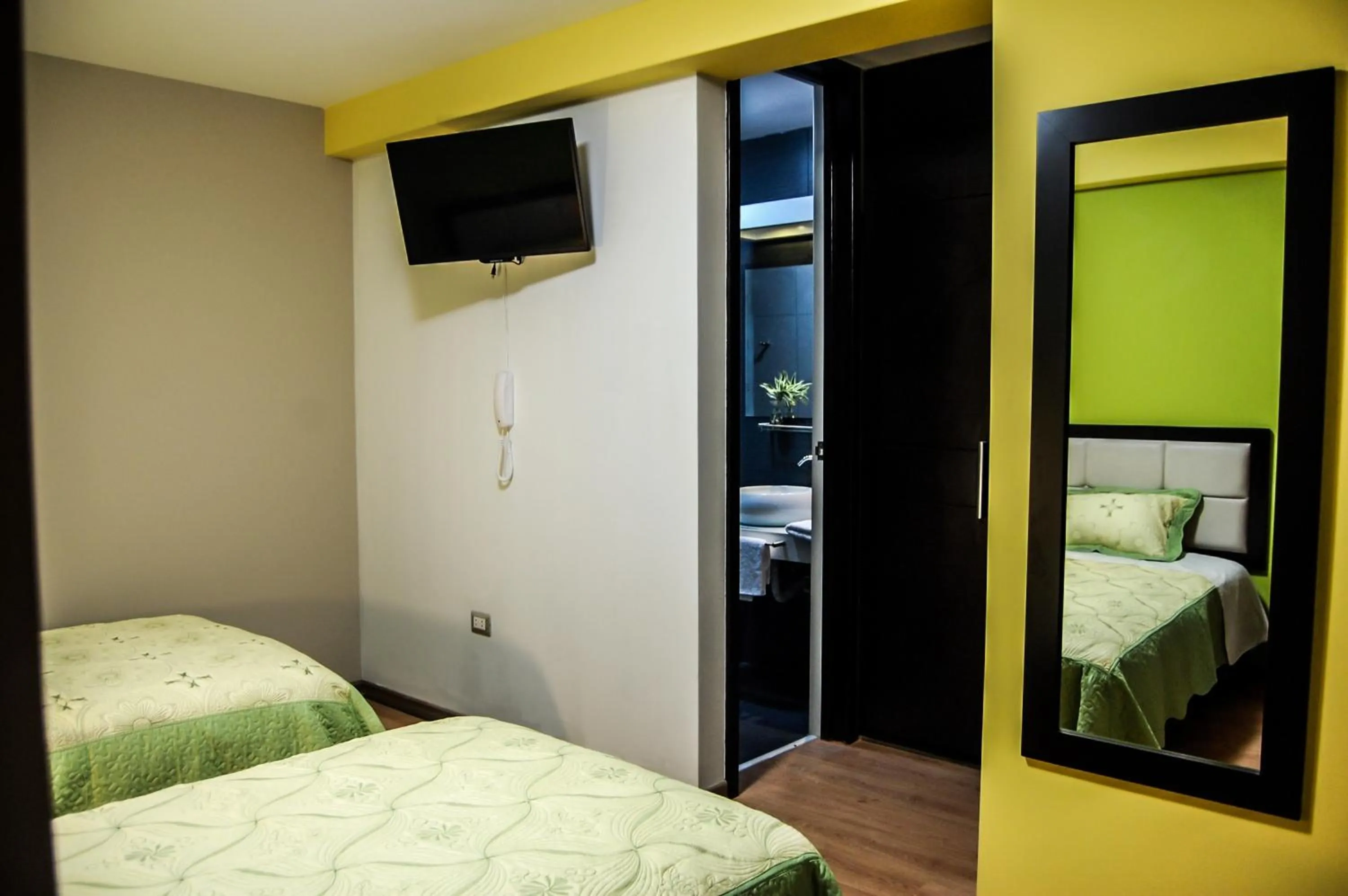 Bed in Plaza Sur Hotel & Suites