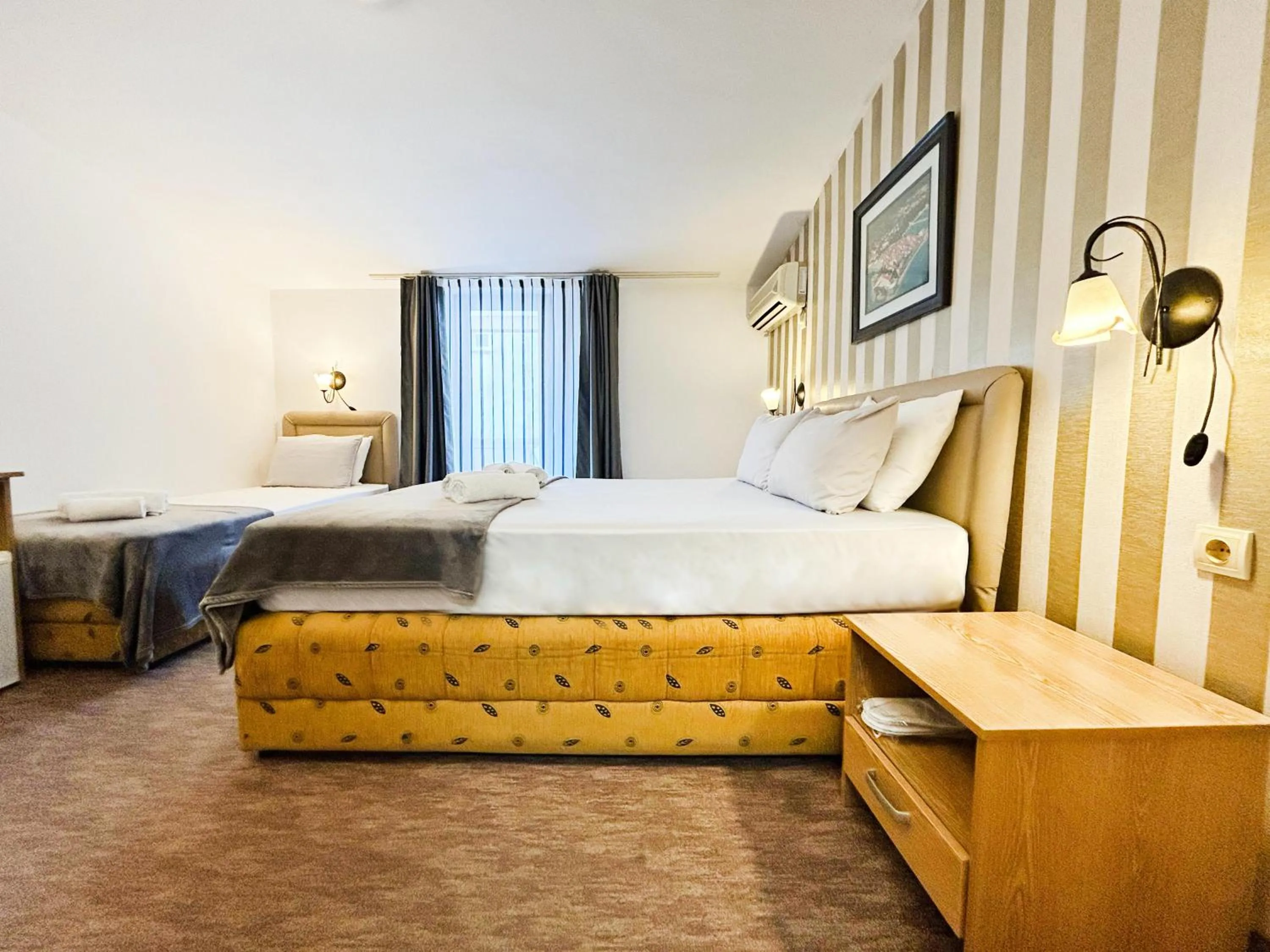 Photo of the whole room, Bed in Central Hotel & Restaurant