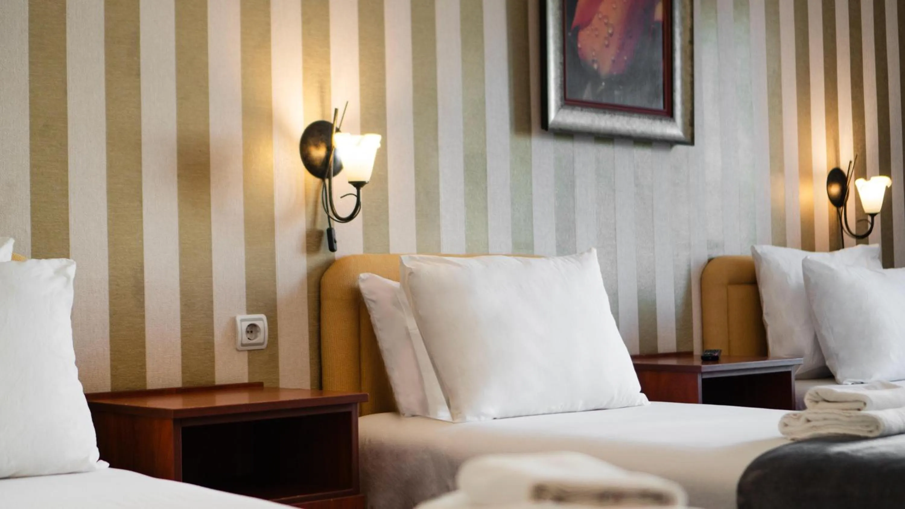 Bed in Central Hotel & Restaurant