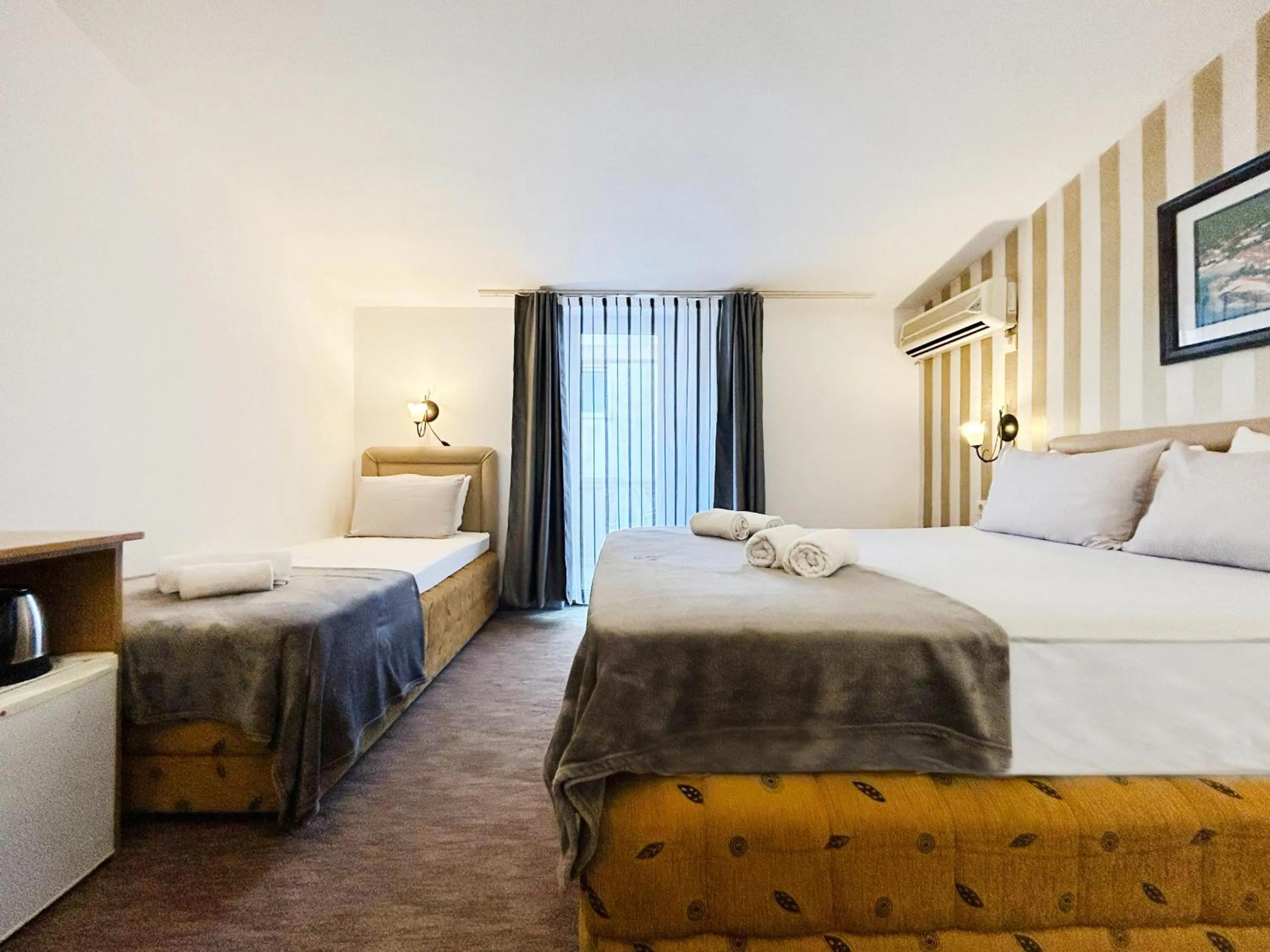 Photo of the whole room, Bed in Central Hotel & Restaurant