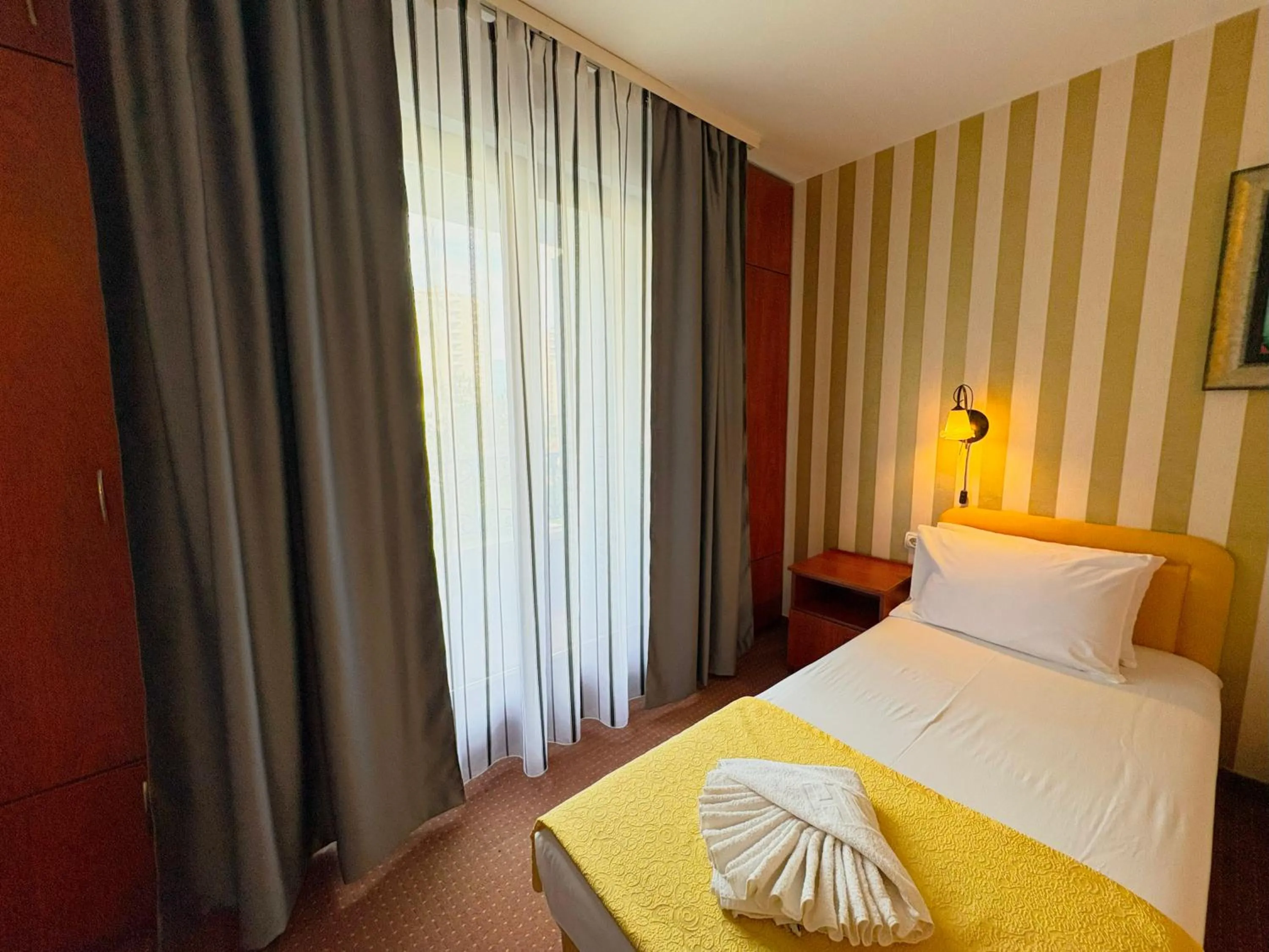 Bed in Central Hotel & Restaurant