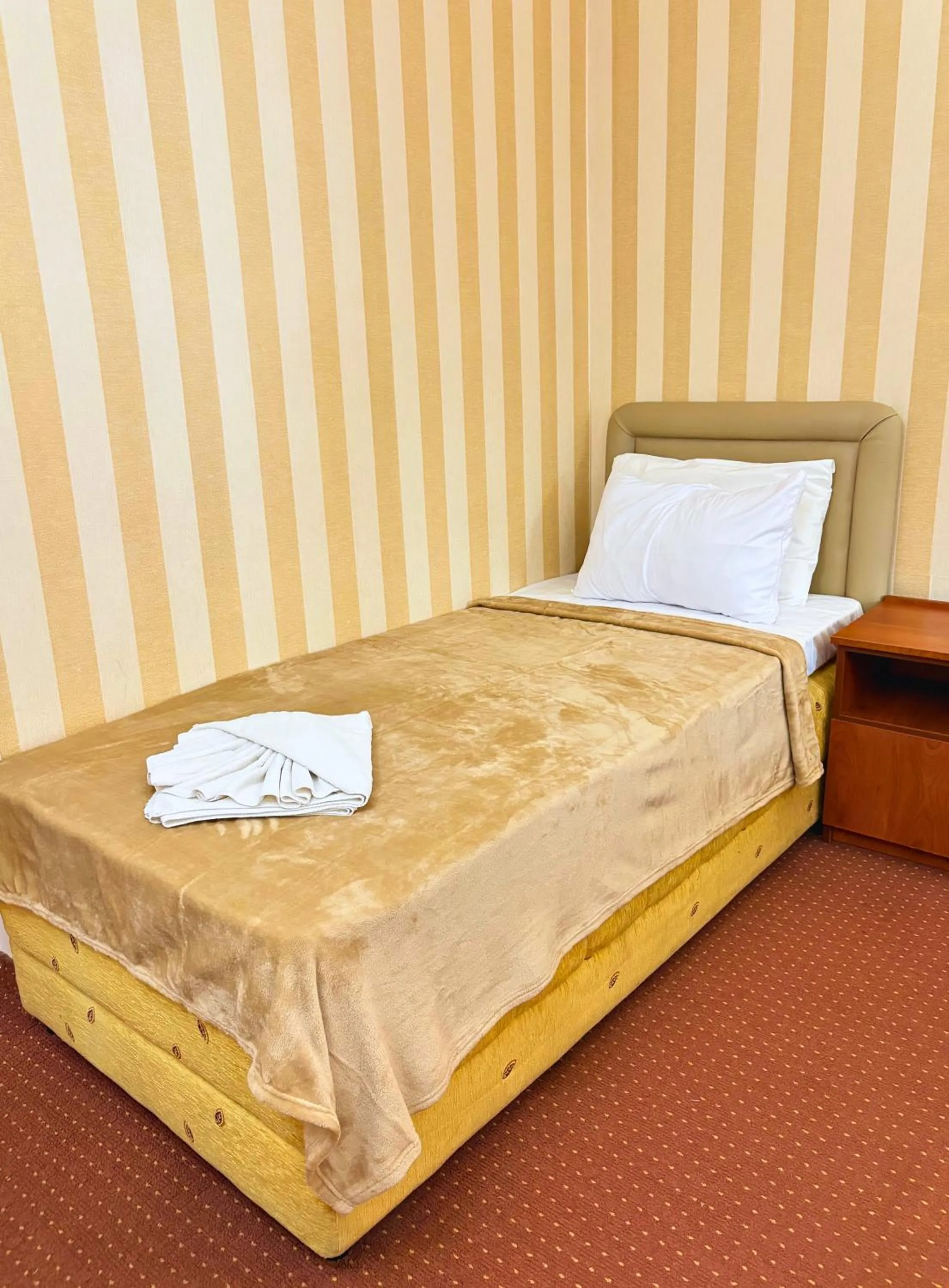 Bed in Central Hotel & Restaurant