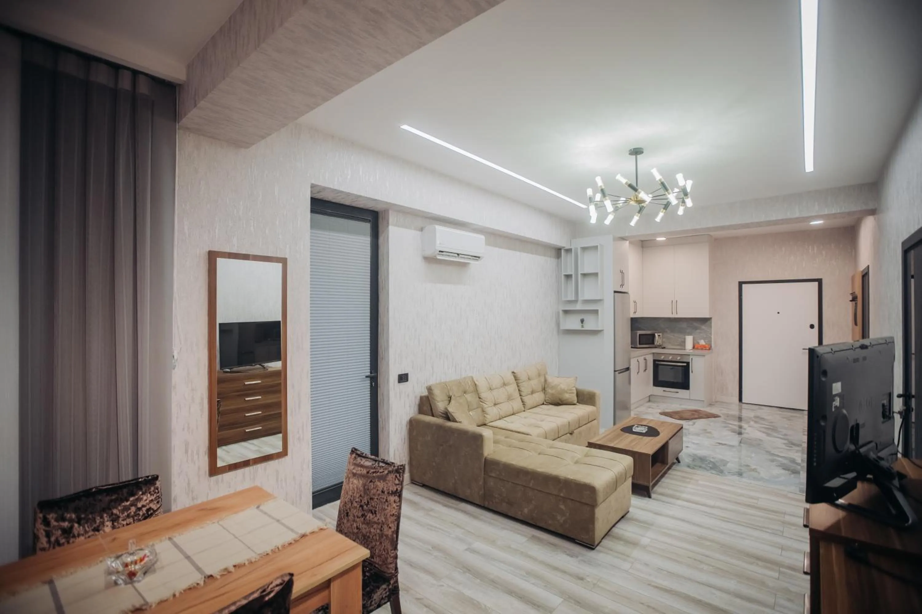 Communal lounge/ TV room in Sabah Bayil Residence Family Apart