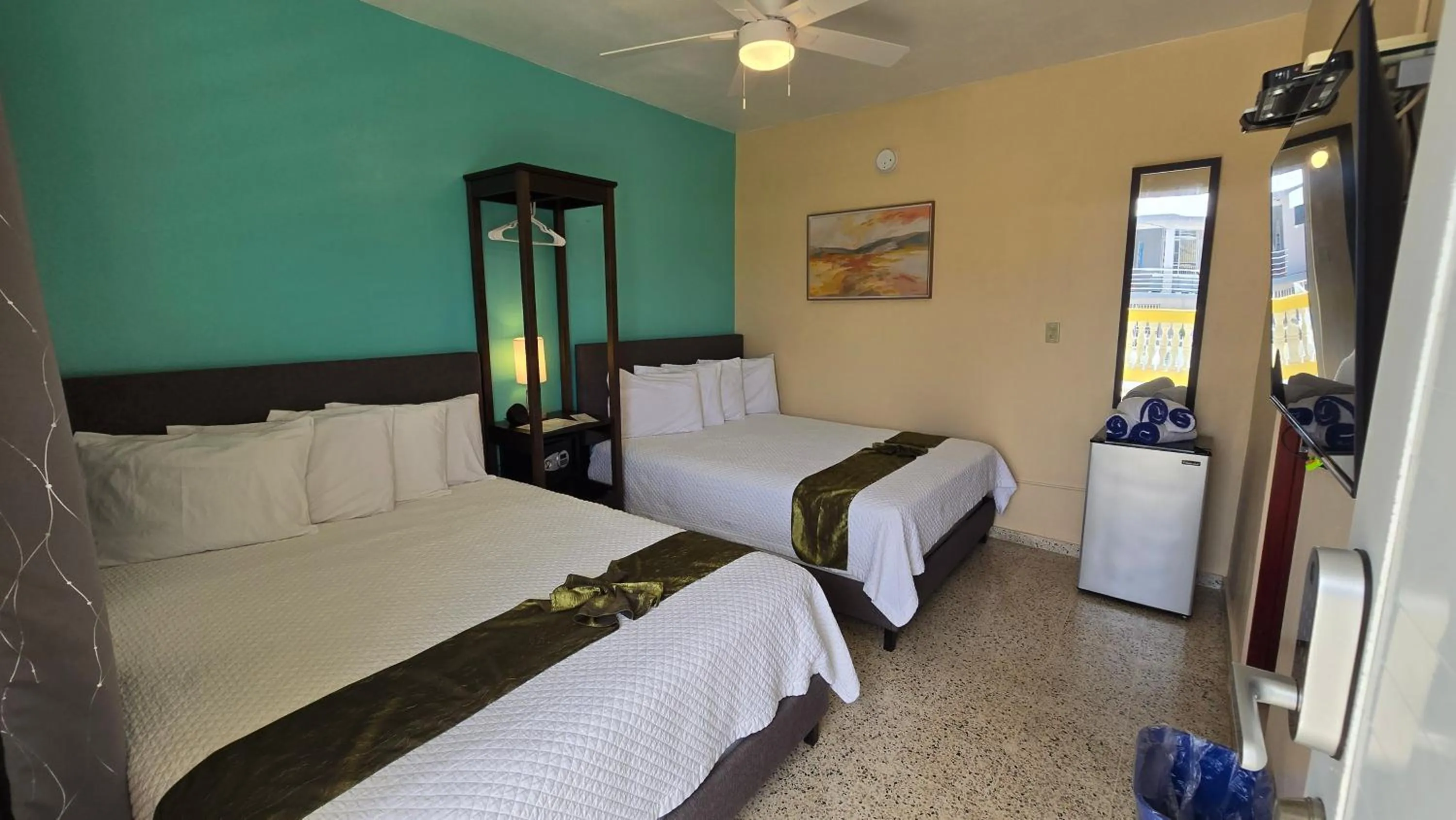 Bed in I Love Combate Rooms & Suites