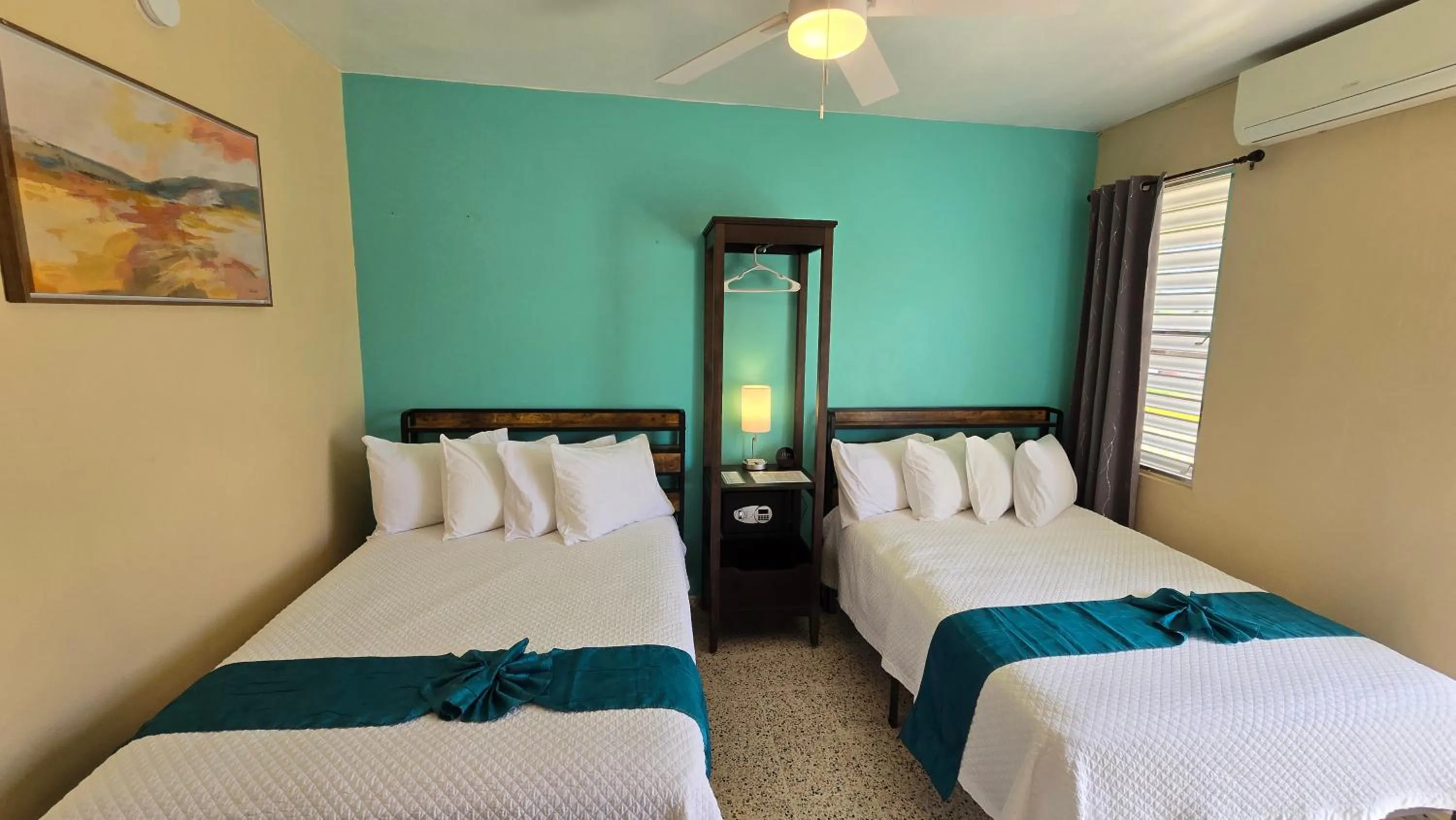 Bed in I Love Combate Rooms & Suites