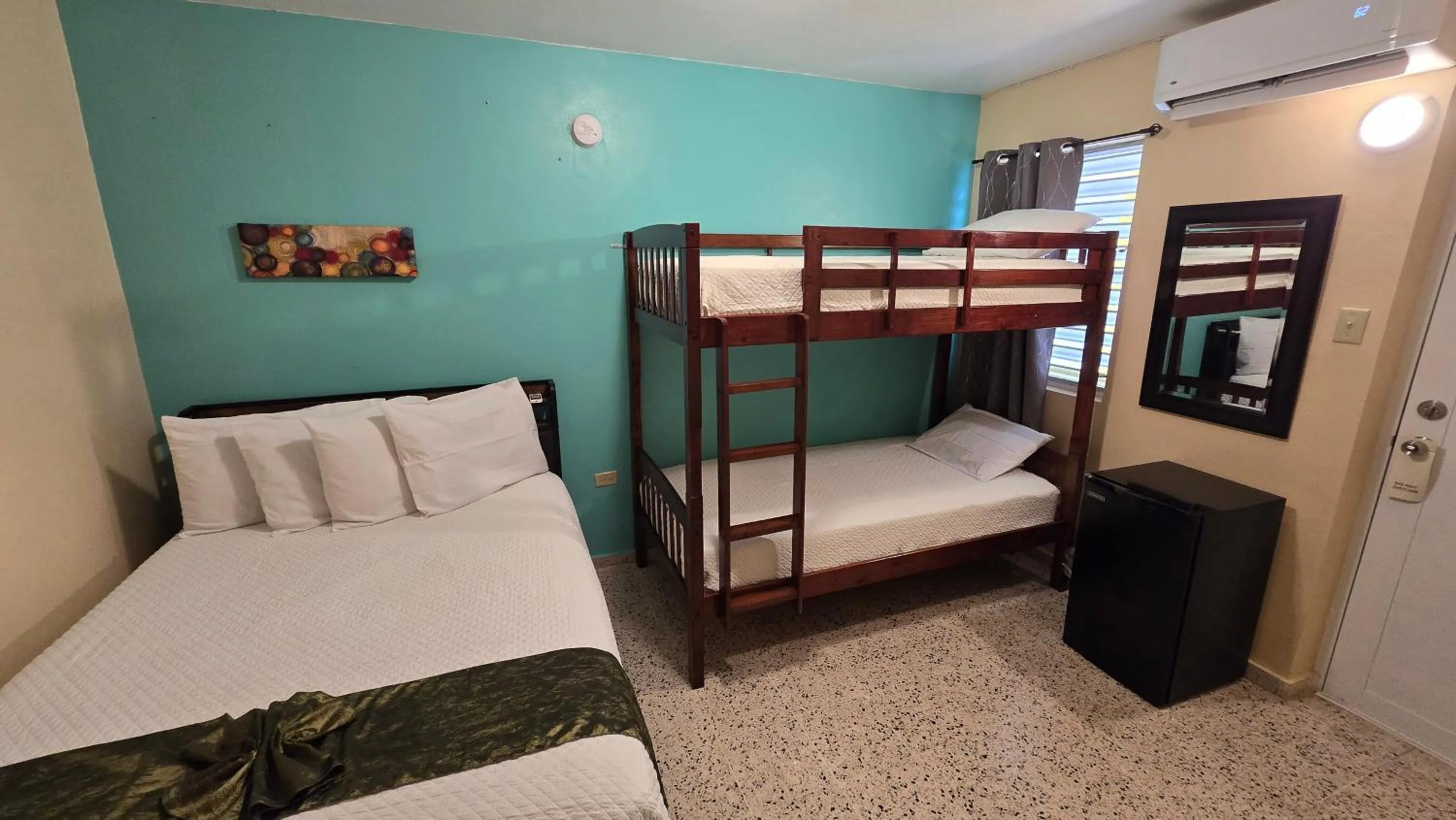 Bed in I Love Combate Rooms & Suites