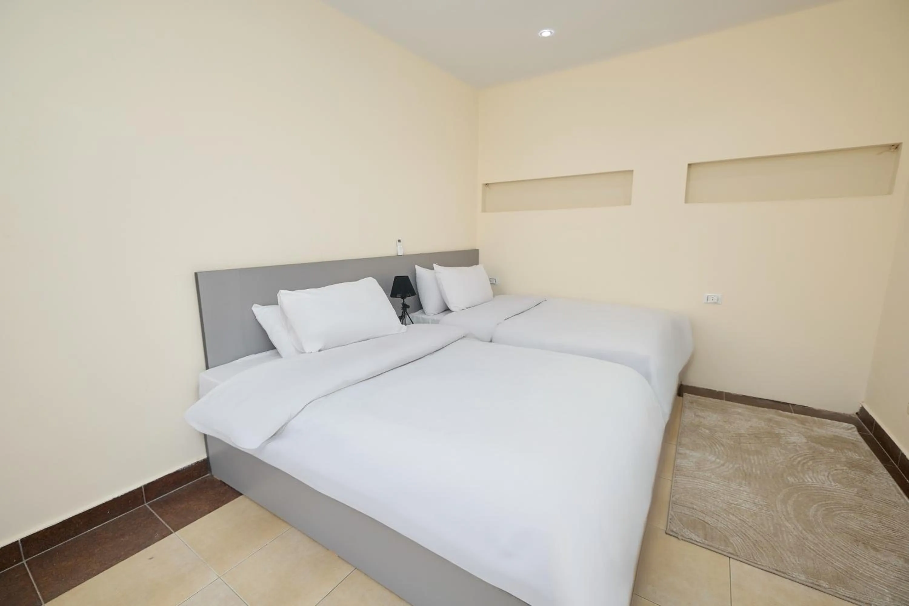 Bed in Settle Inn Al Rehab City A