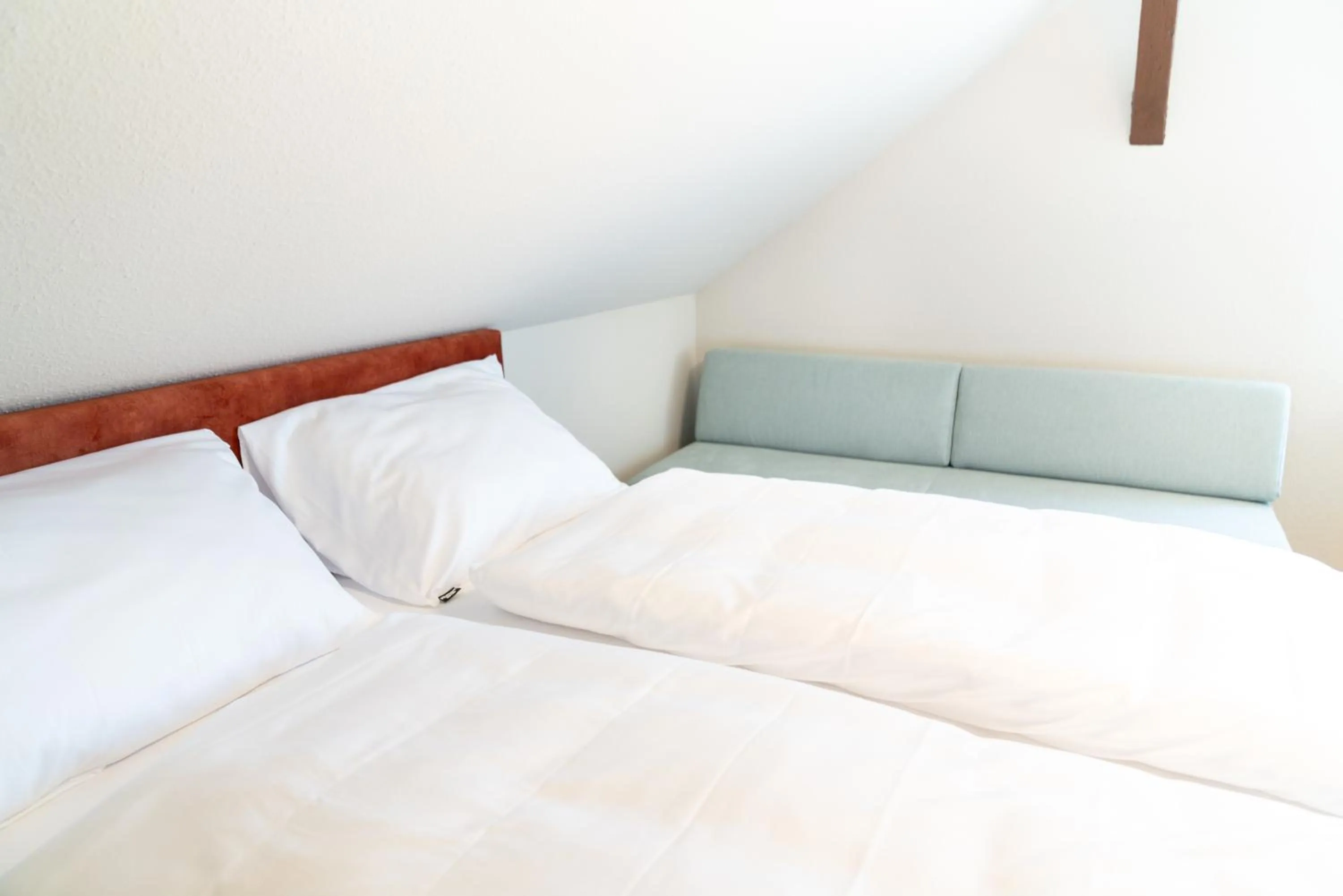 Bed in Velotique Hotel Angelika - Self-Check-in