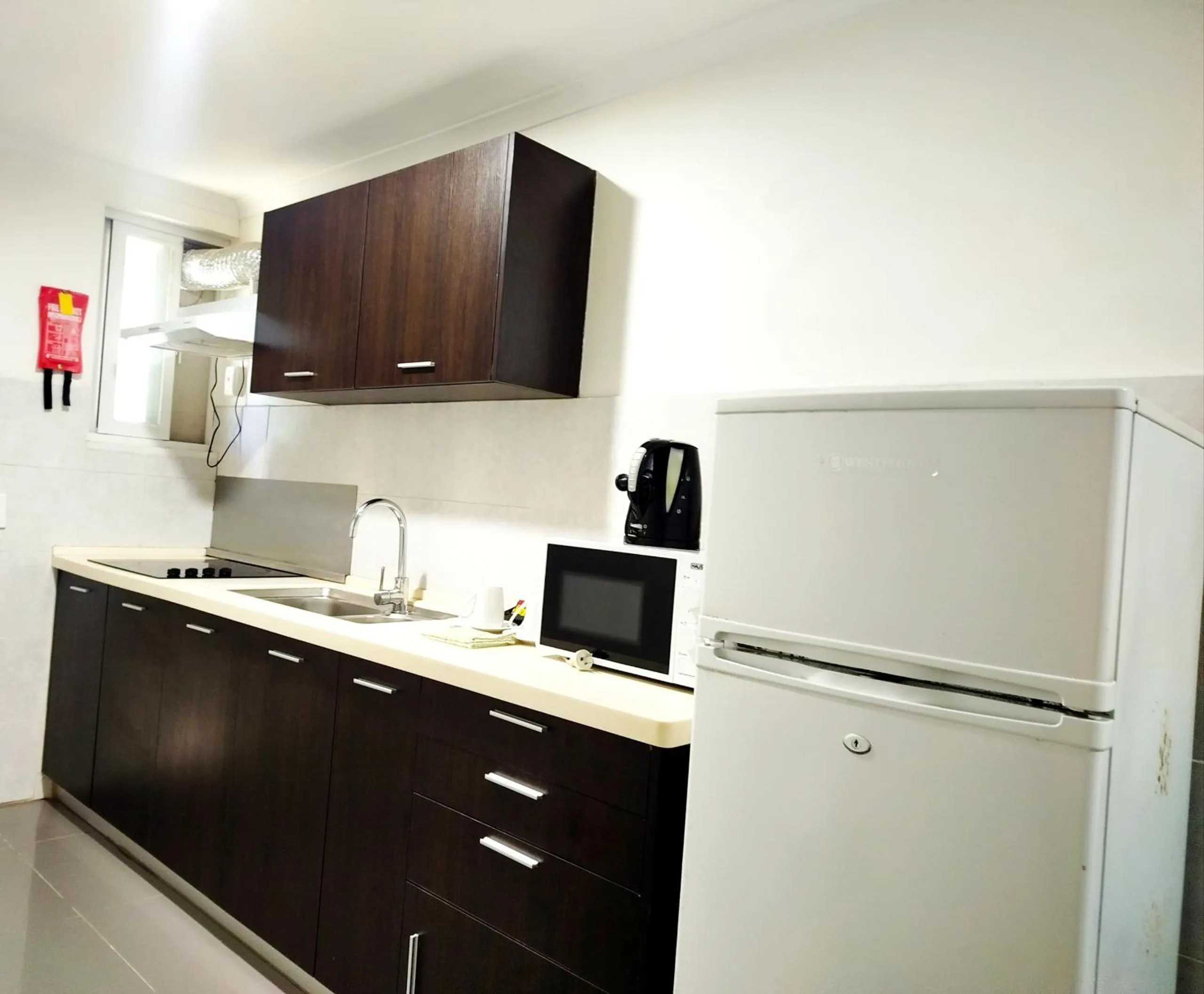 Kitchen or kitchenette in Citi Serviced Apartments - Gaba Place