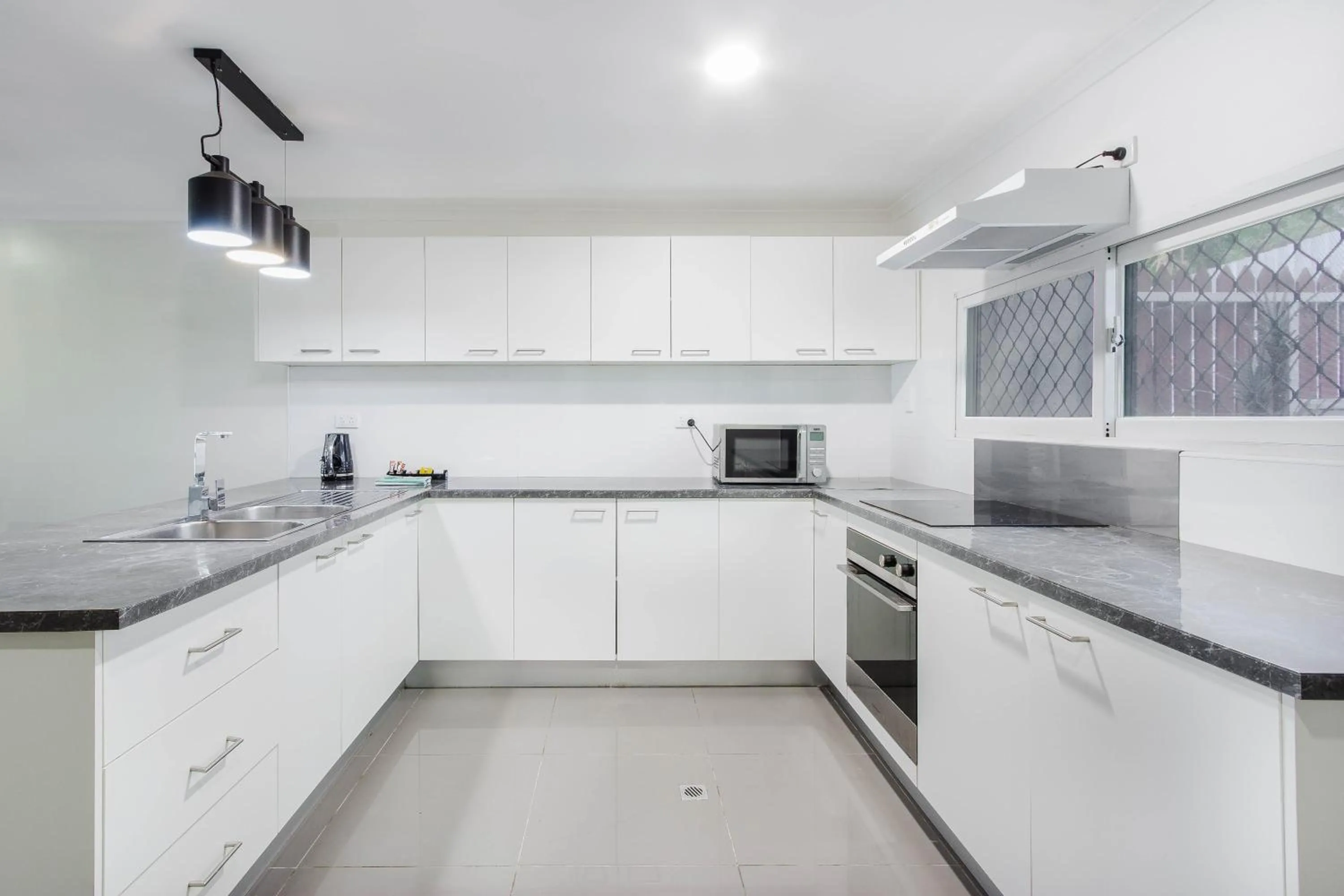 Kitchen or kitchenette in Citi Serviced Apartments - Gaba Place