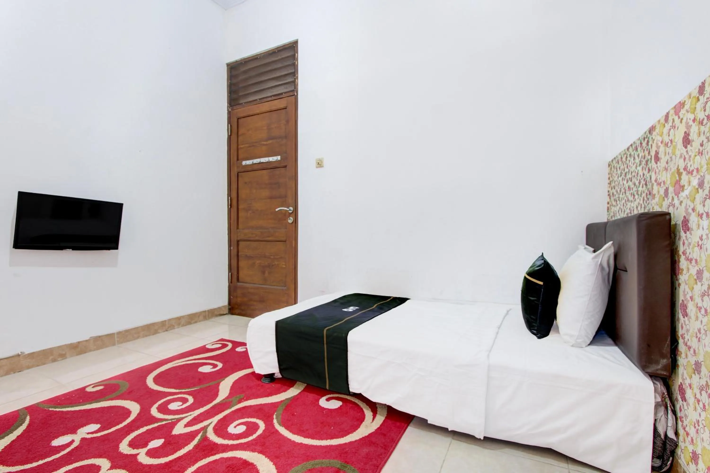 Bed in SPOT ON Podomoro Homestay