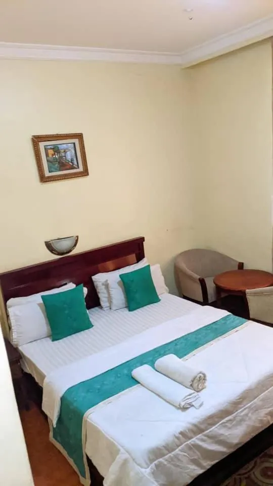 Bed in Rungwe Palace Hotel