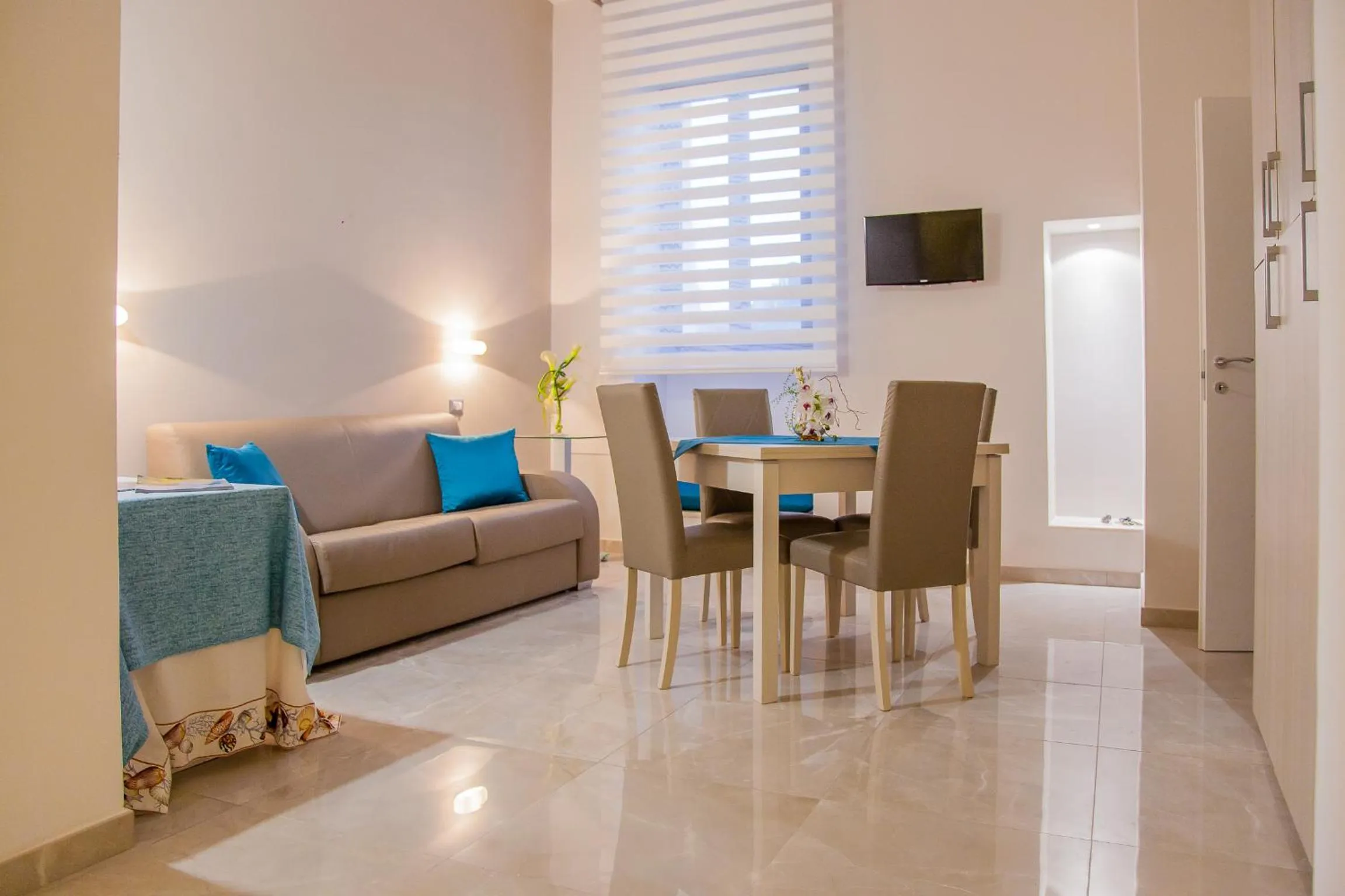 Communal lounge/ TV room in Acquamarina B&b