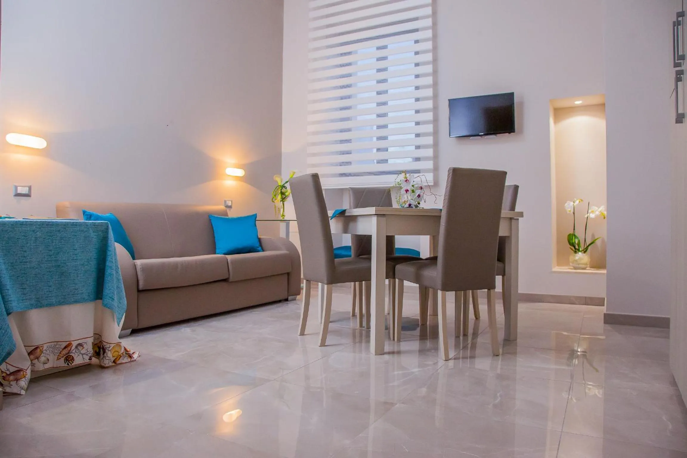 Communal lounge/ TV room in Acquamarina B&b