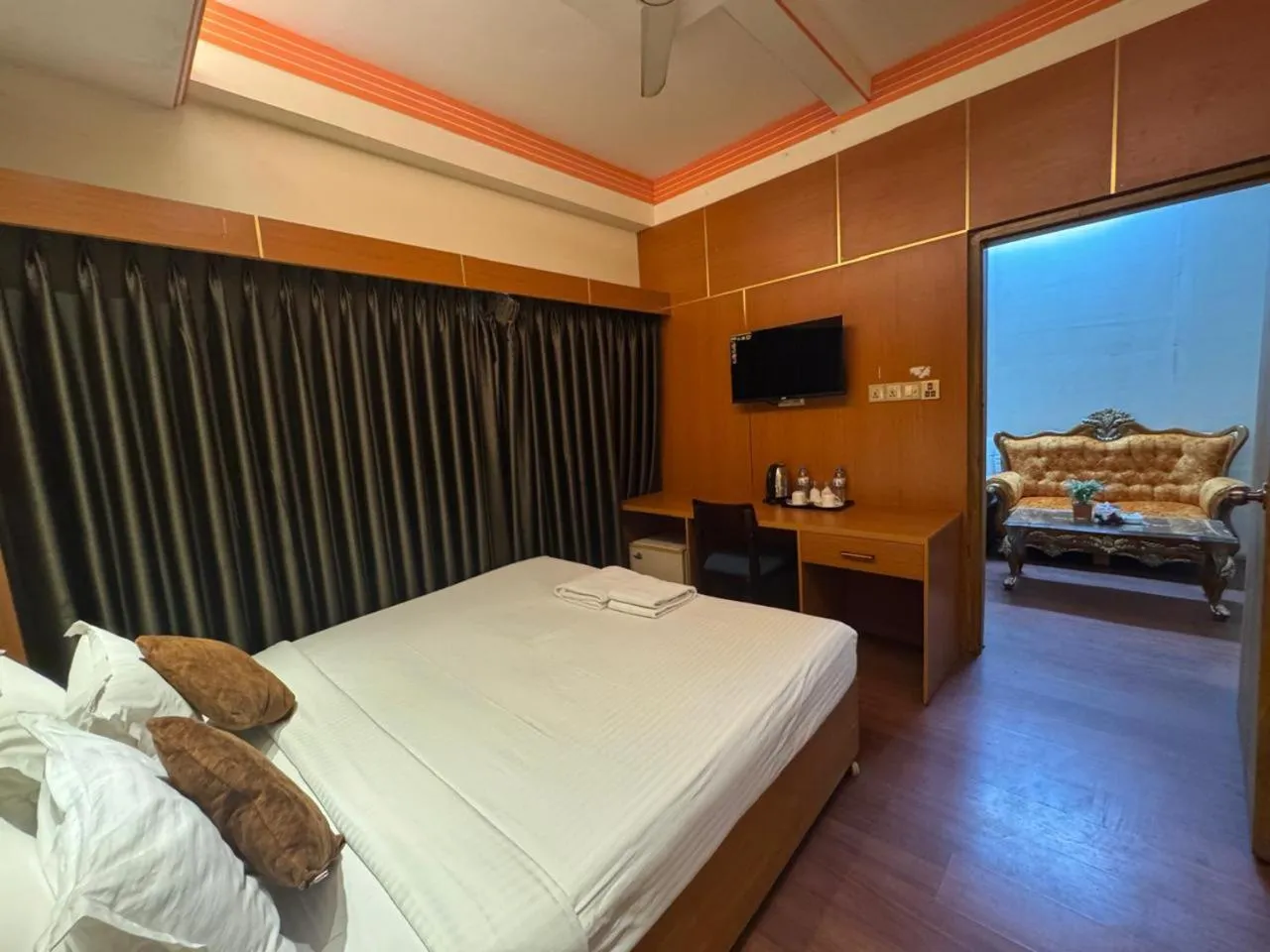 Communal lounge/ TV room, Bed in Hotel Rosewood Uttara