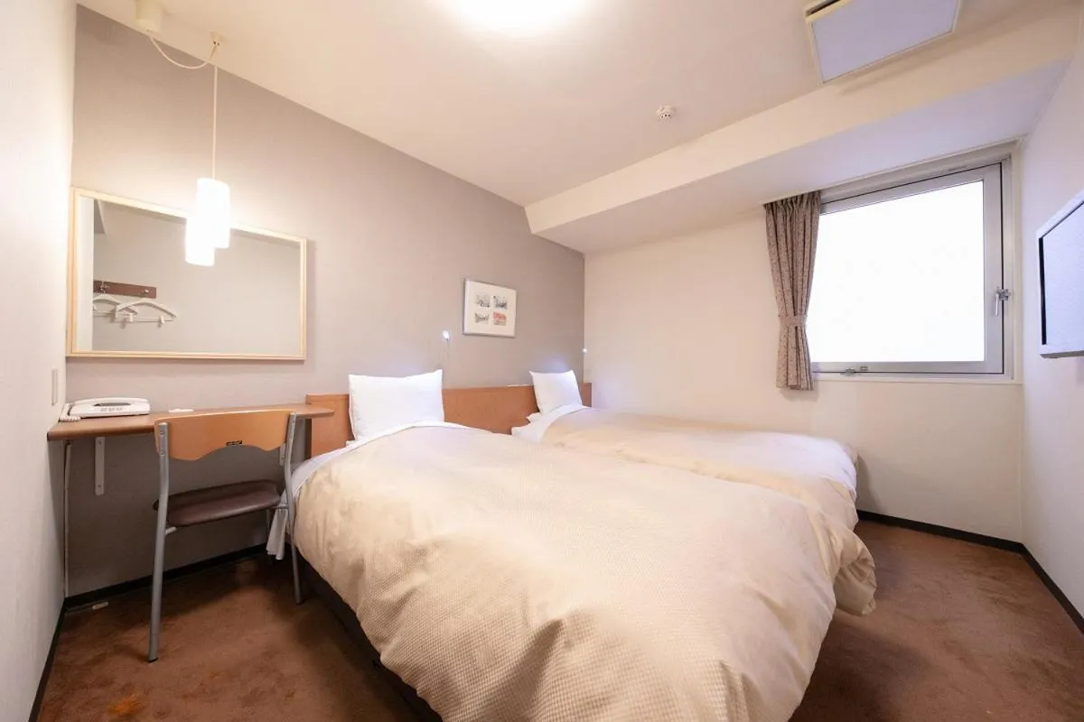 Bed in Morioka City Hotel