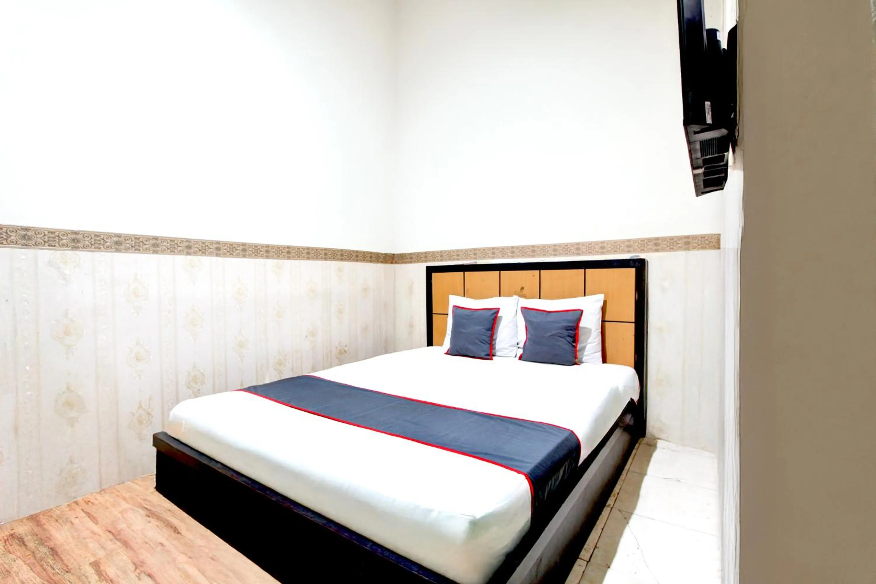 Bed in Hotel O Mega Inn Guest House