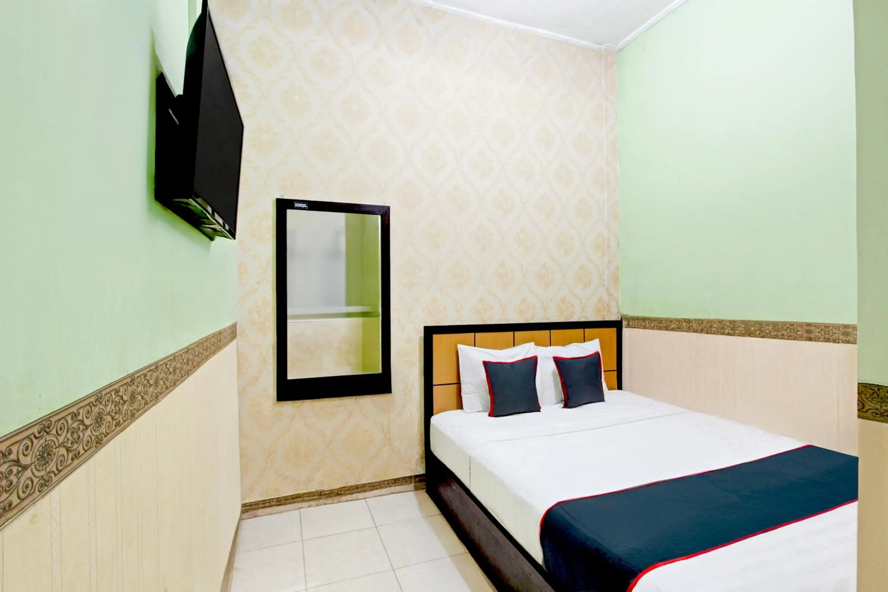 Bed in Hotel O Mega Inn Guest House