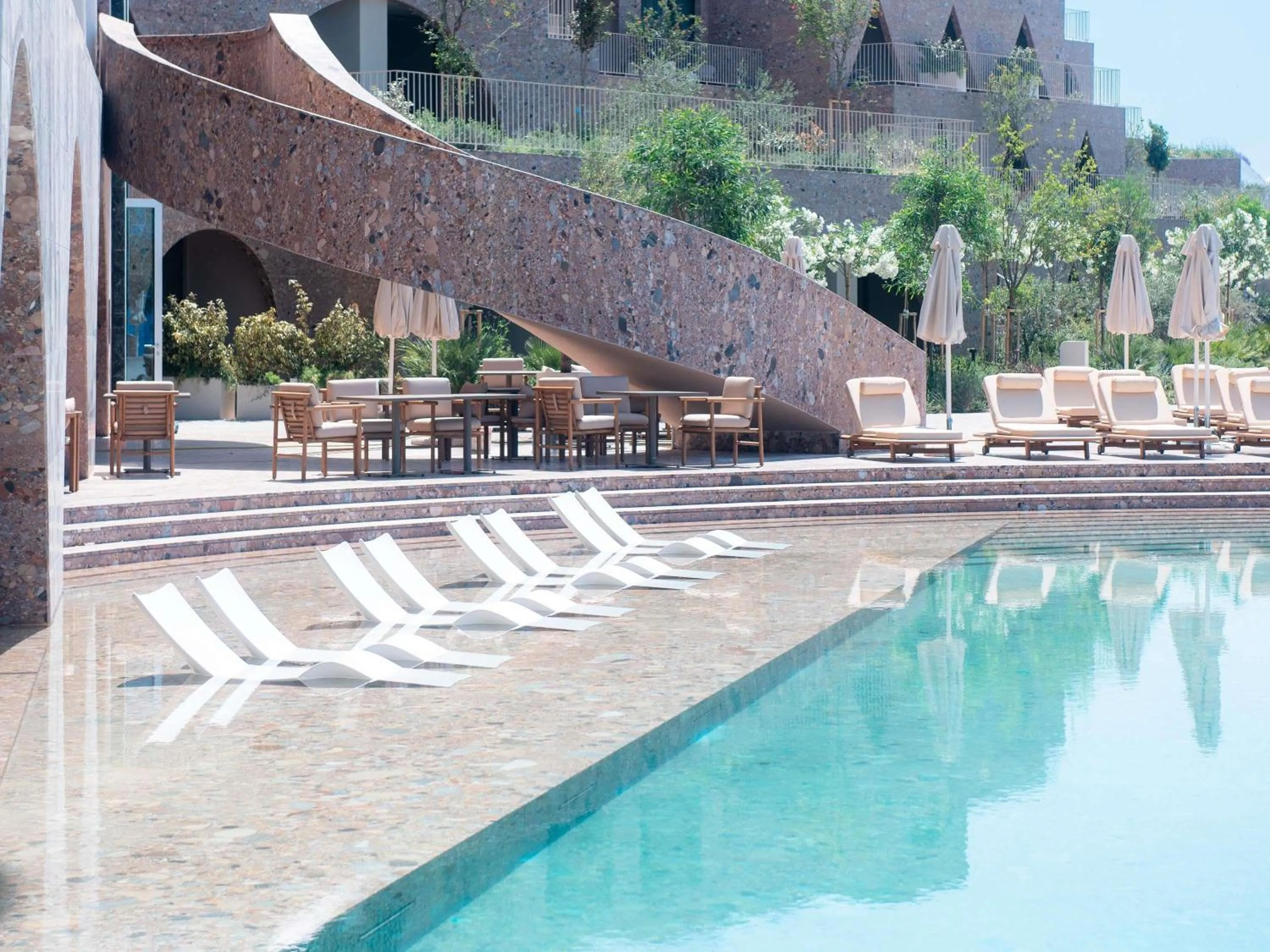 Pool view in Green Coast Hotel MGallery Collection