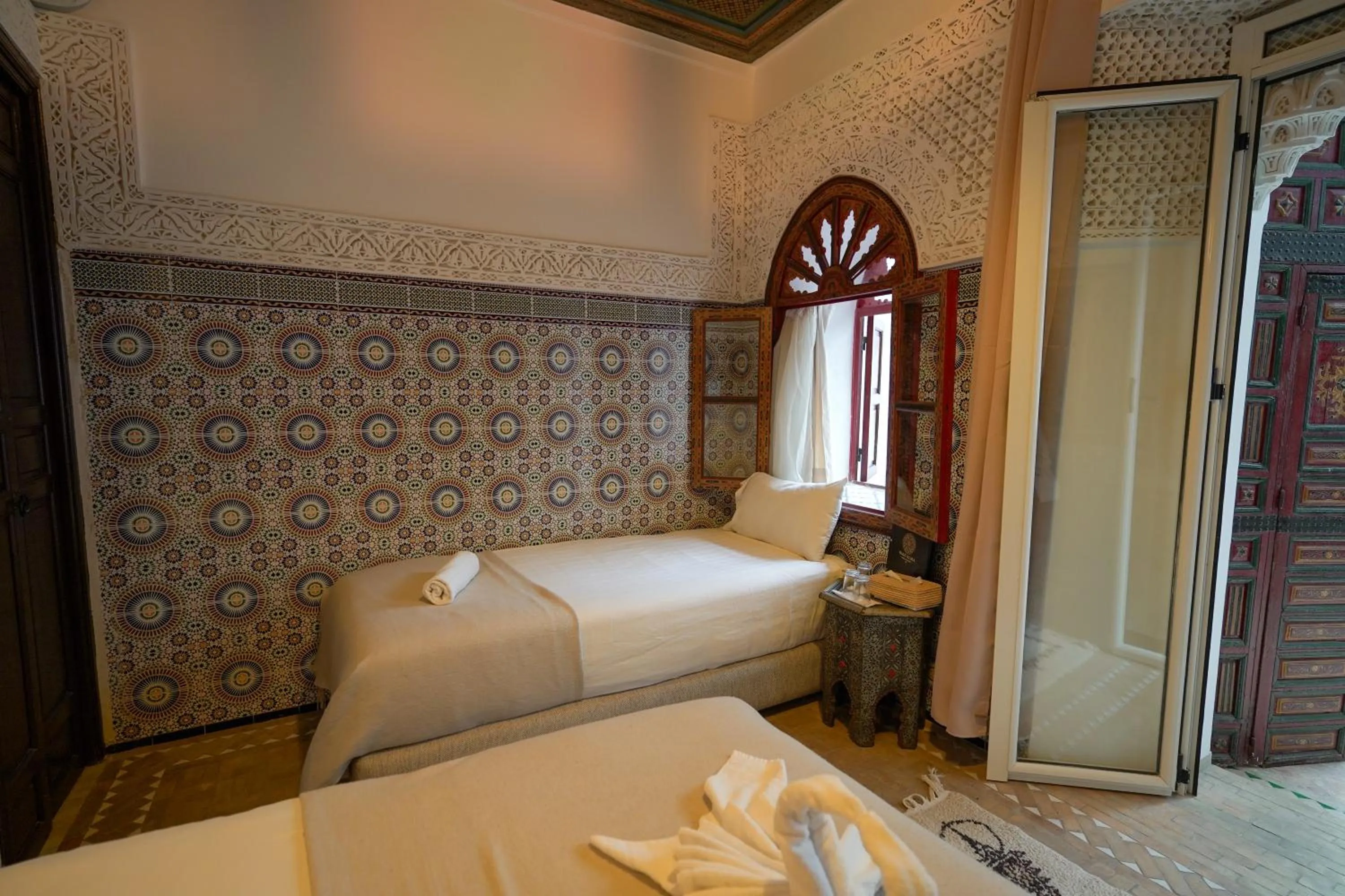 Bed in Riad Alma Mouassine
