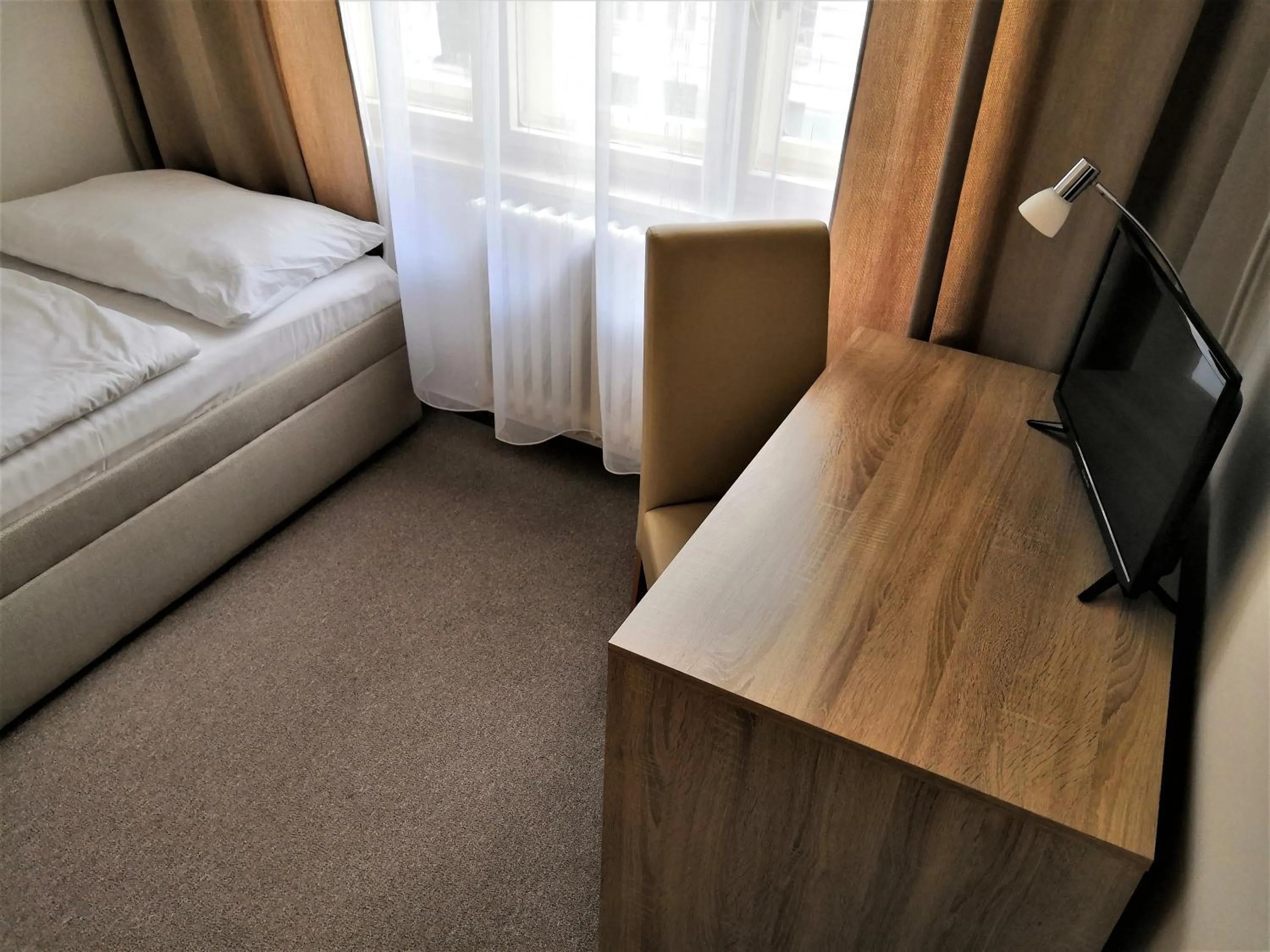 Bed in Hotel Marianeum