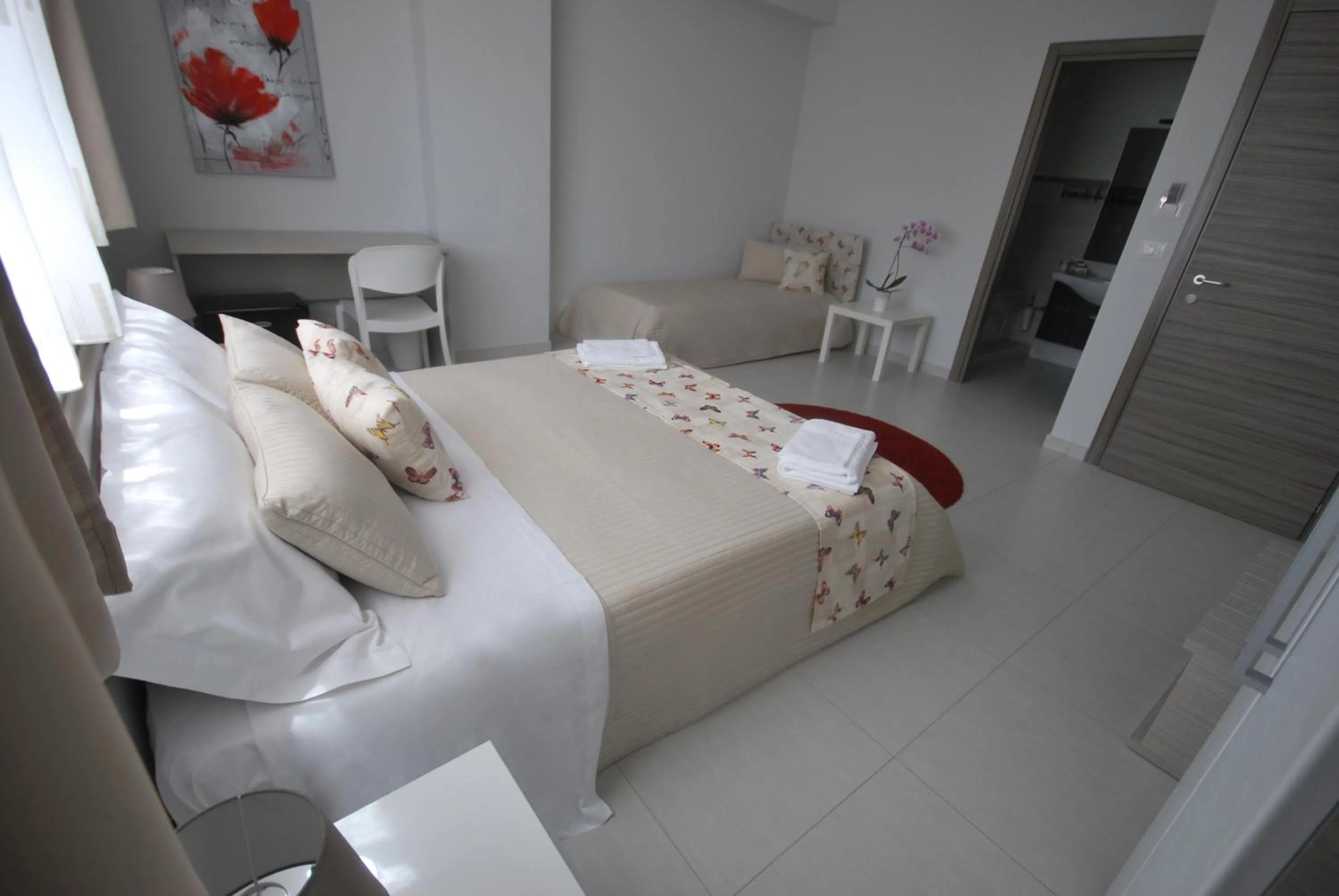 Bed in Pietra Bianca Rooms