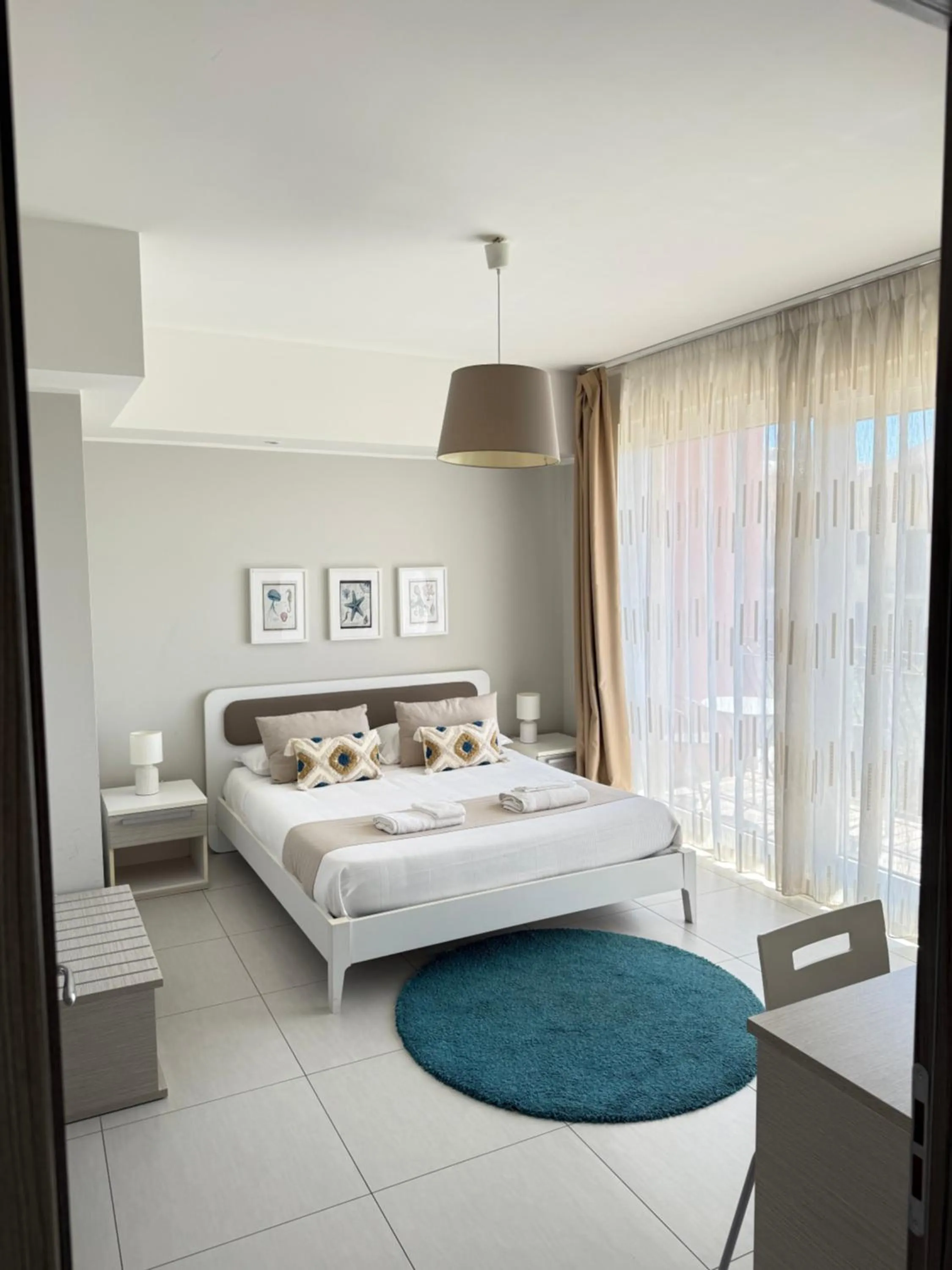 Bed in Pietra Bianca Rooms