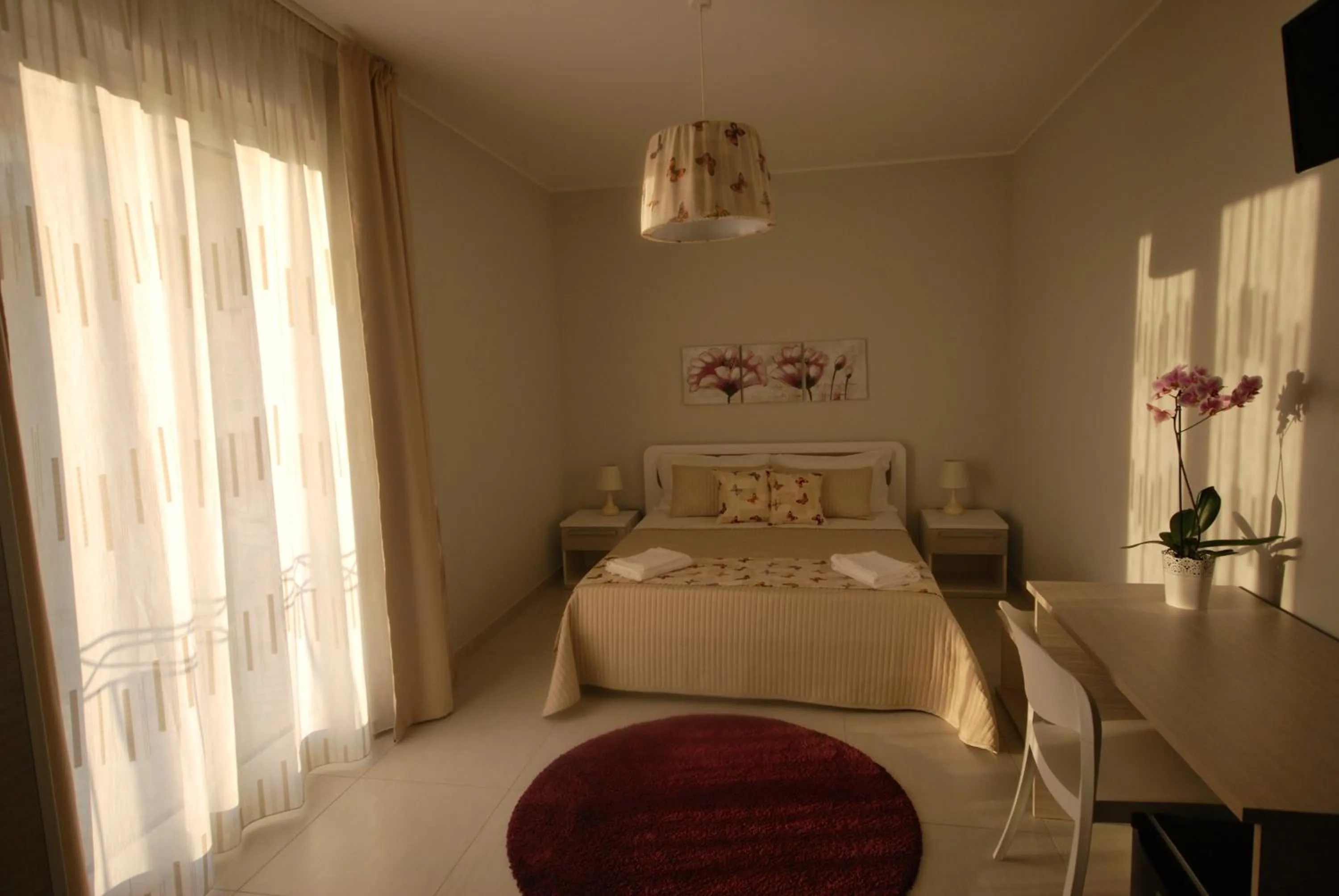 Bed in Pietra Bianca Rooms