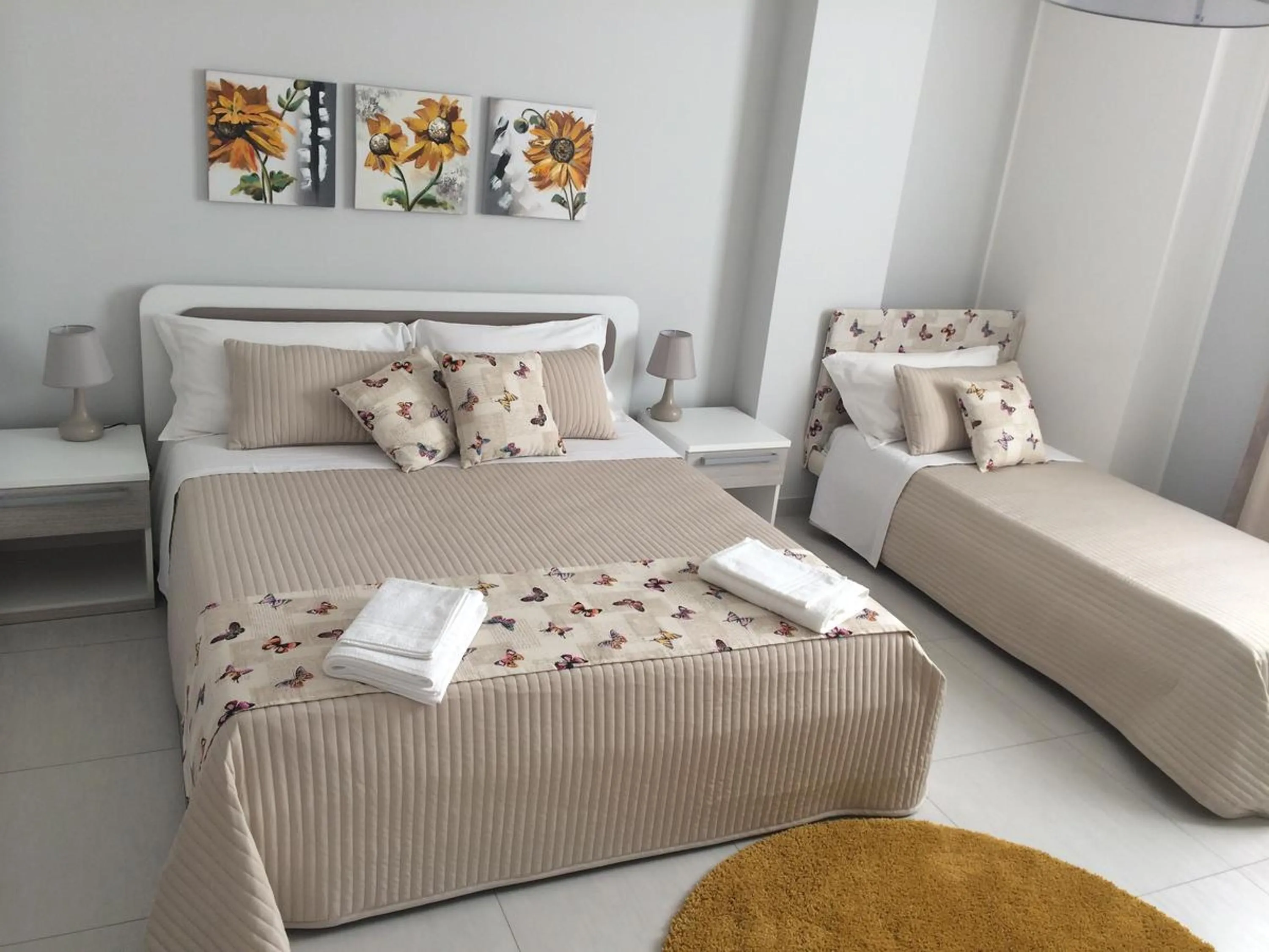 Bed in Pietra Bianca Rooms