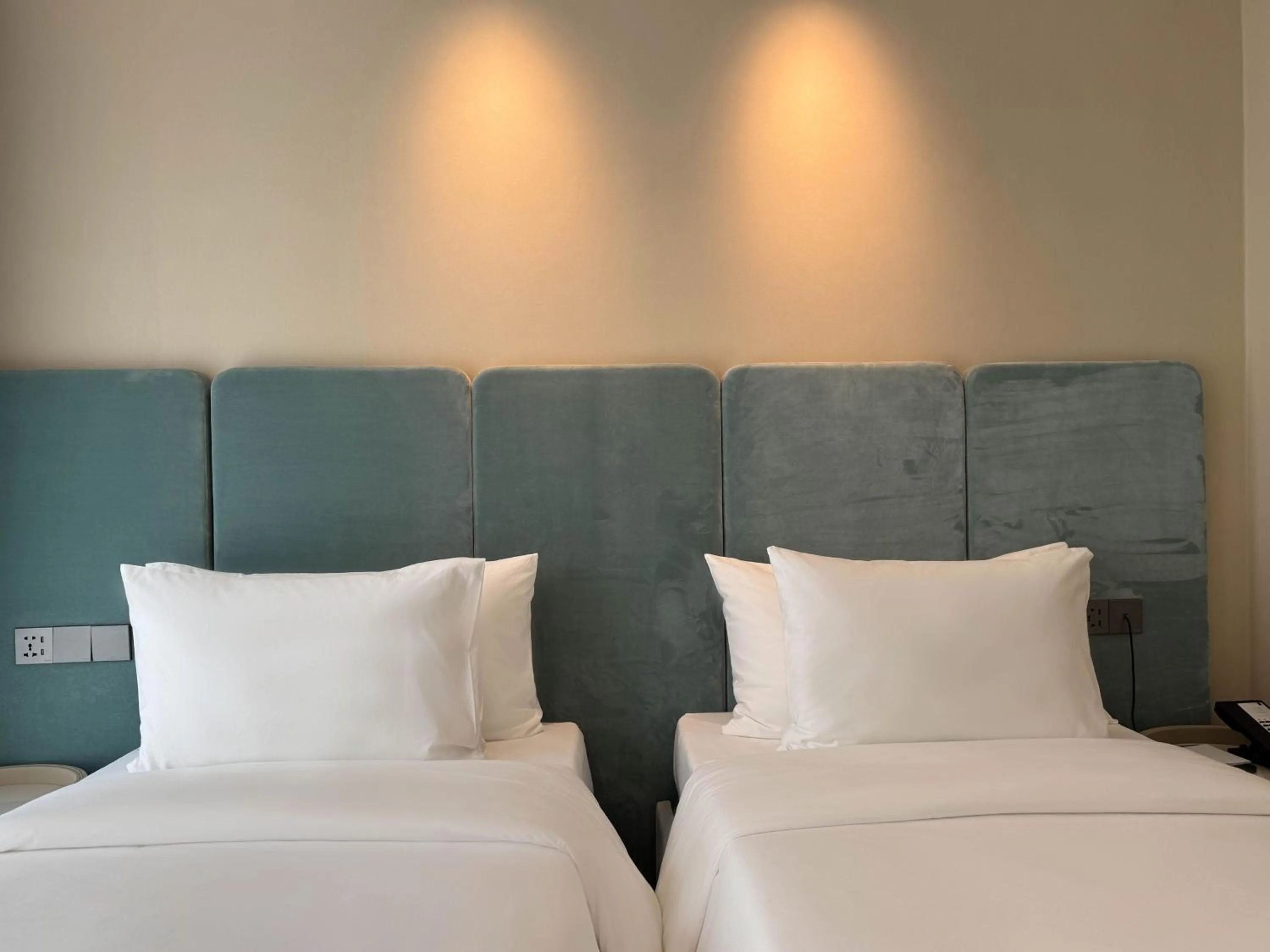 Bed in Laya Suites and Residences