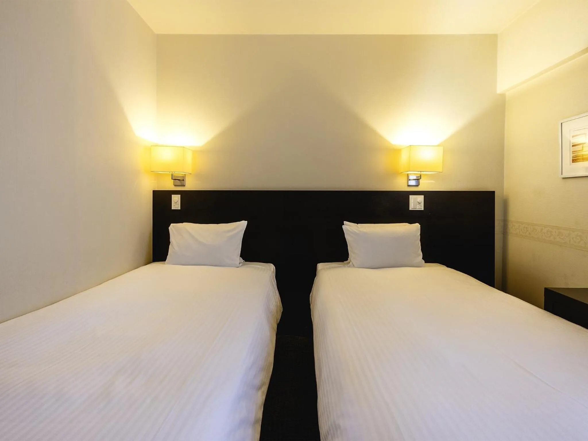 Bed in KOKO HOTEL Yokohama Tsurumi