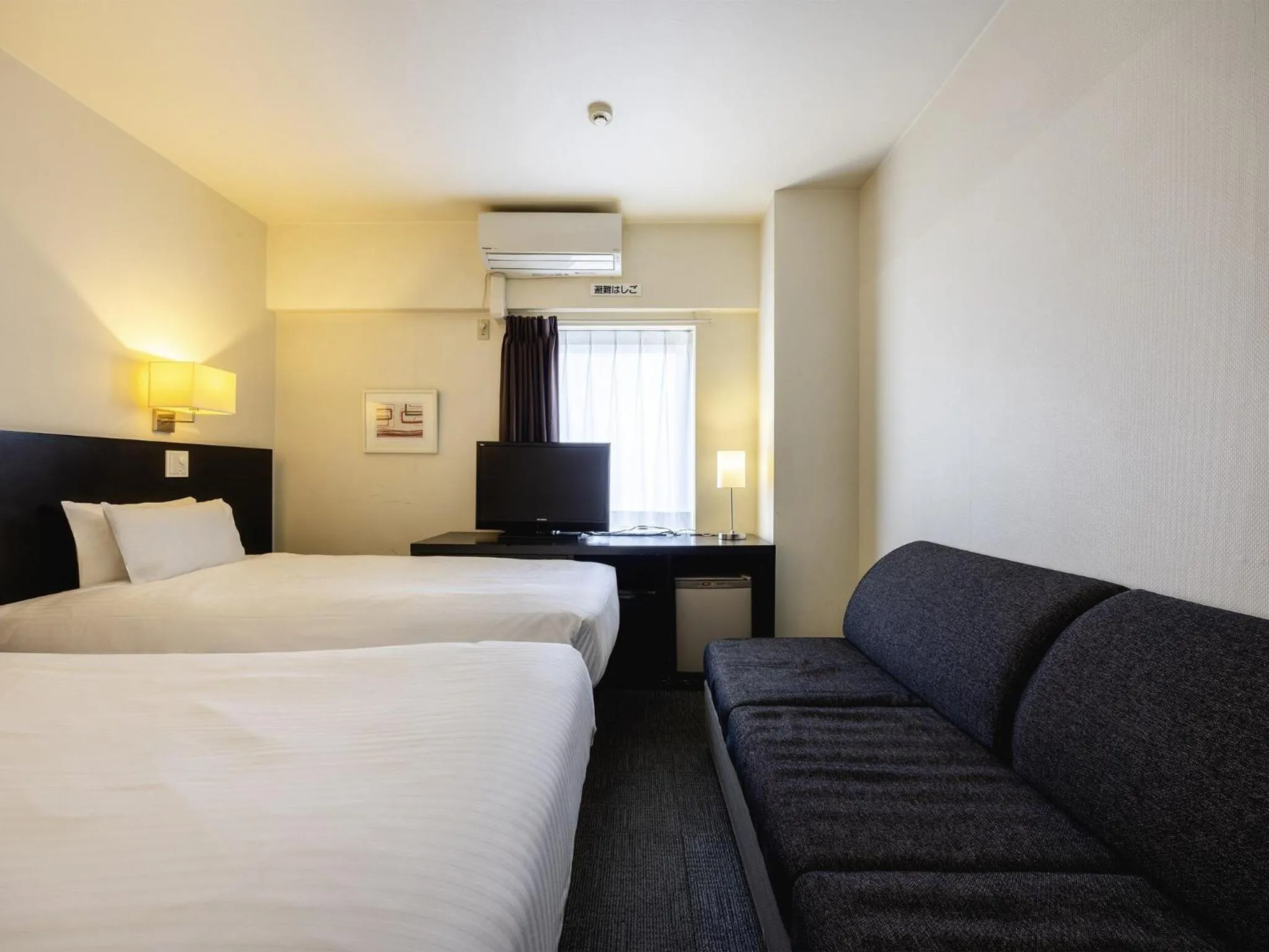 Photo of the whole room, Bed in KOKO HOTEL Yokohama Tsurumi