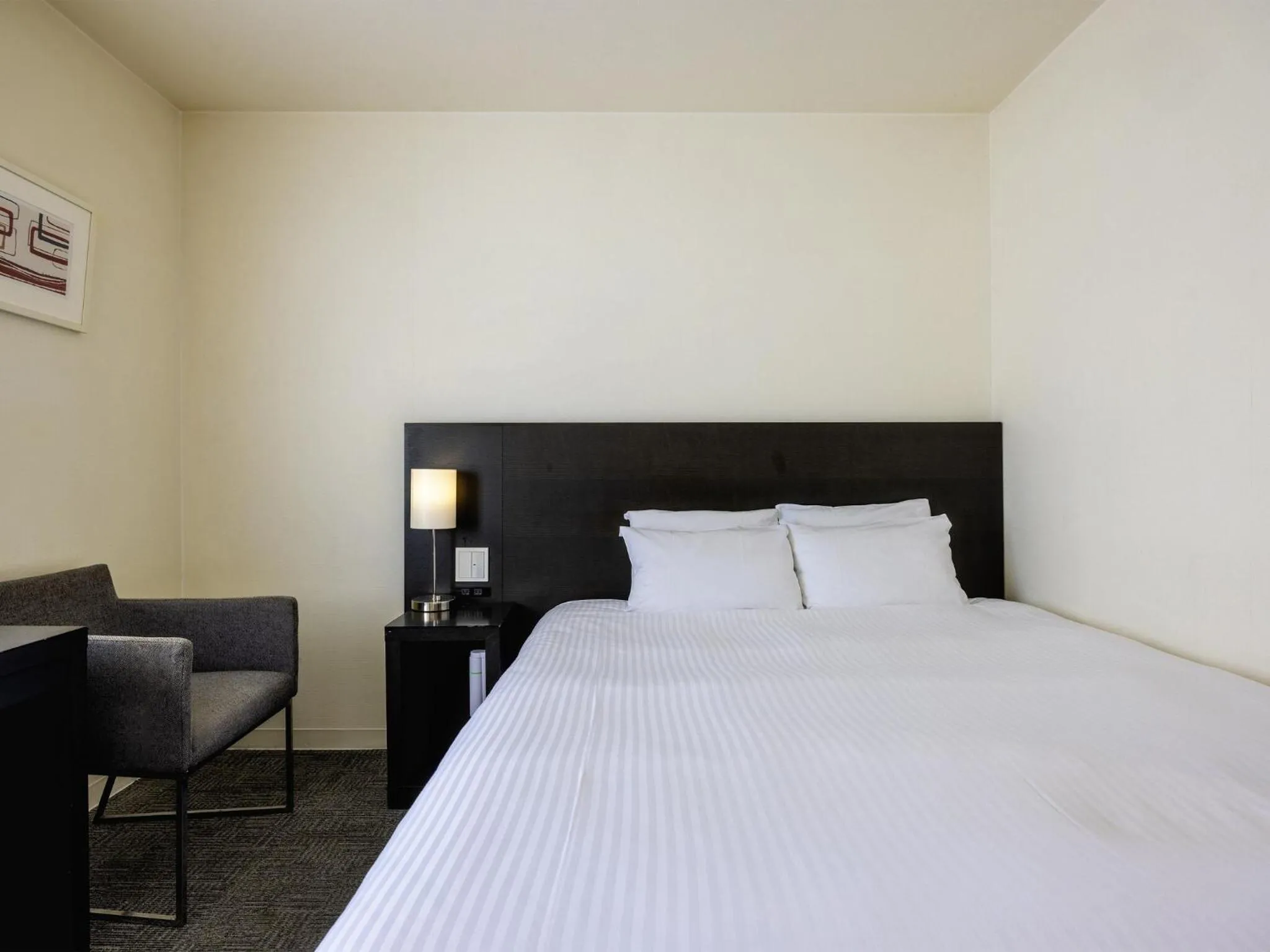 Bed in KOKO HOTEL Yokohama Tsurumi