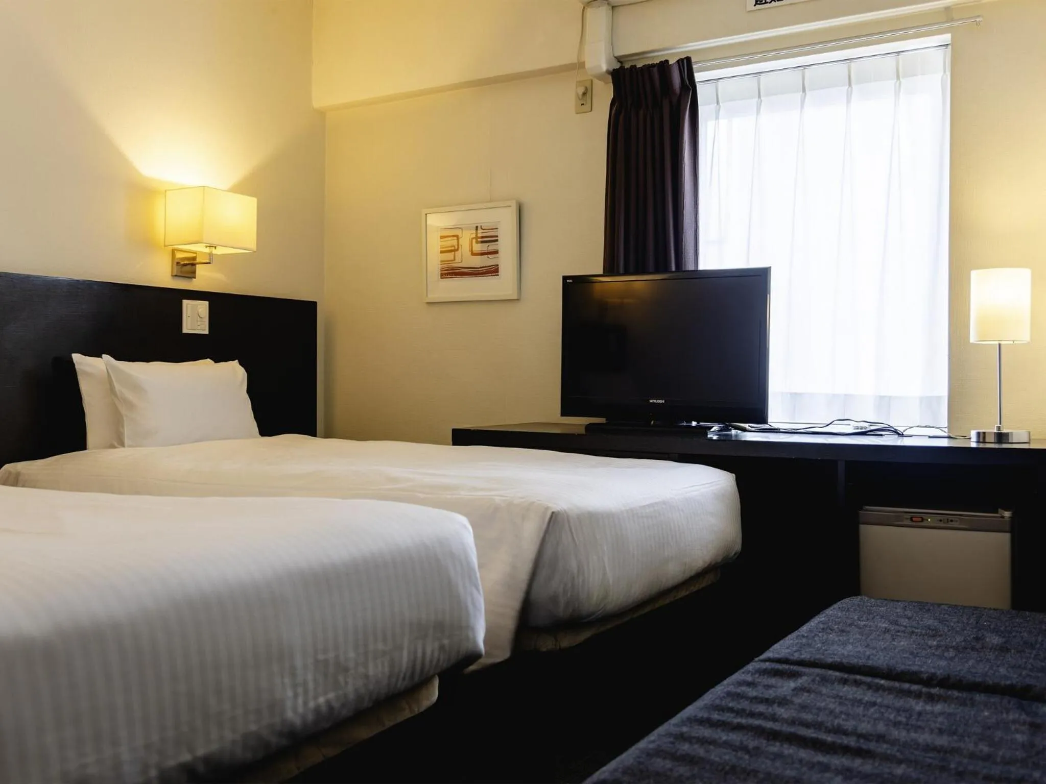 Photo of the whole room, Bed in KOKO HOTEL Yokohama Tsurumi