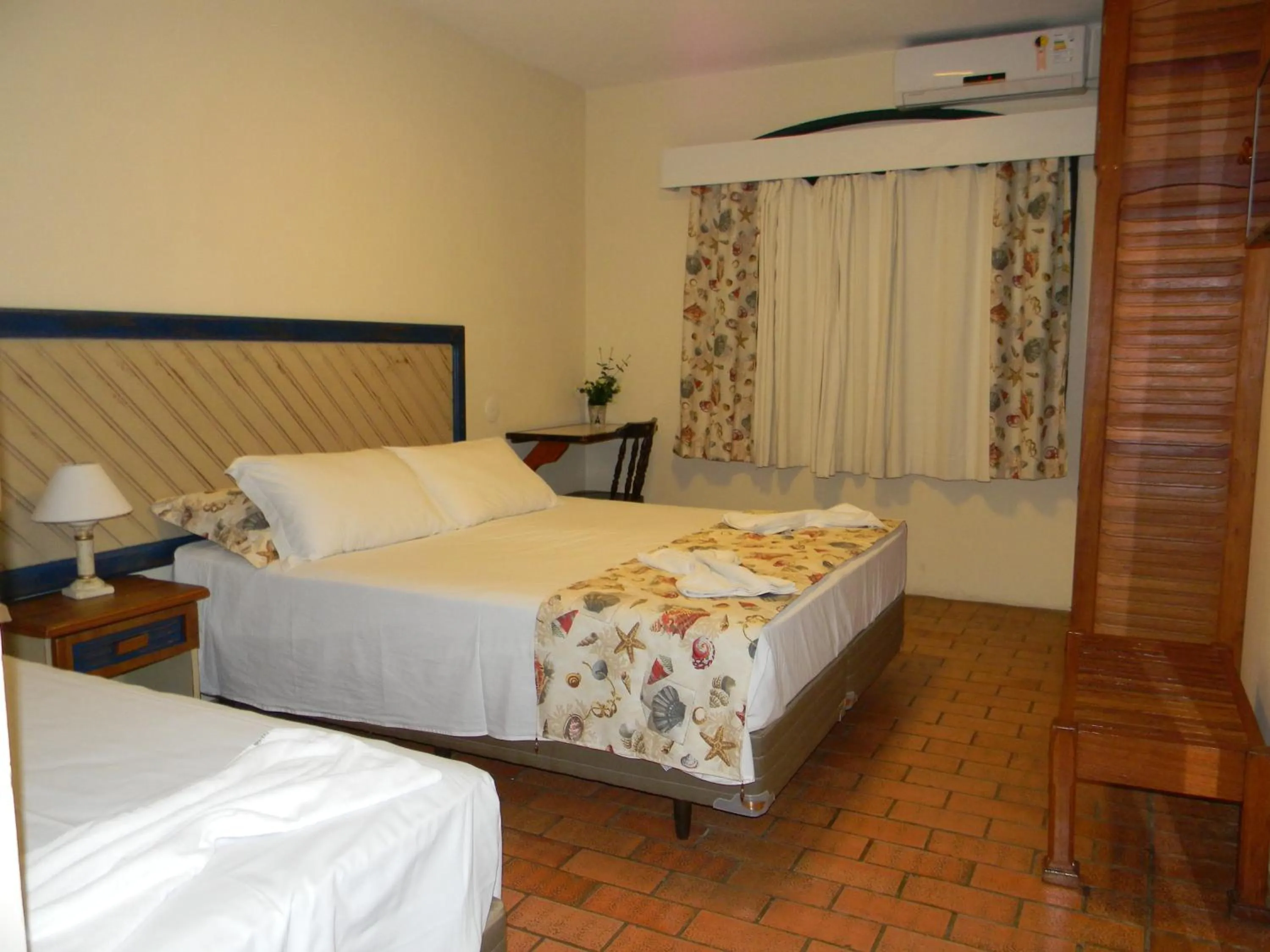 Bed in Pousada Recanto da Prainha