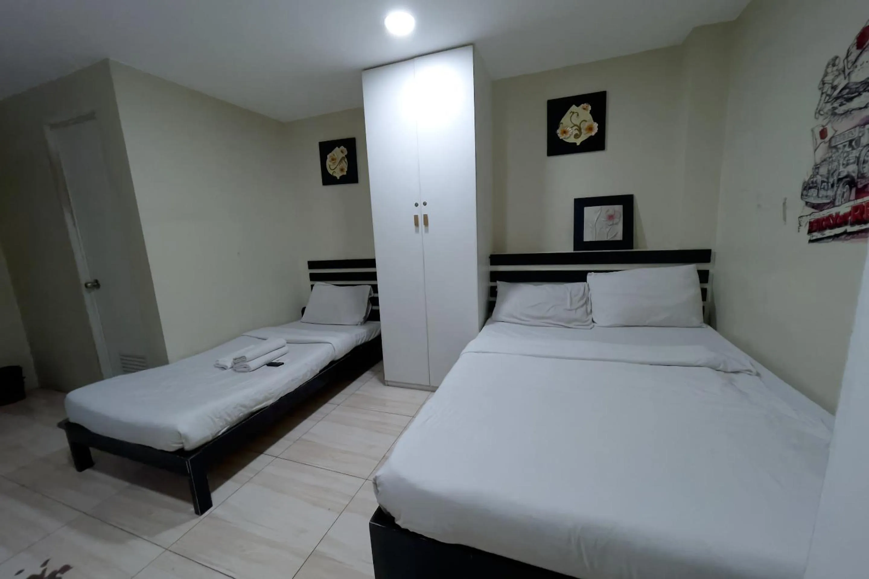 Bed in Jardin Oriental Suites Ubelt Manila