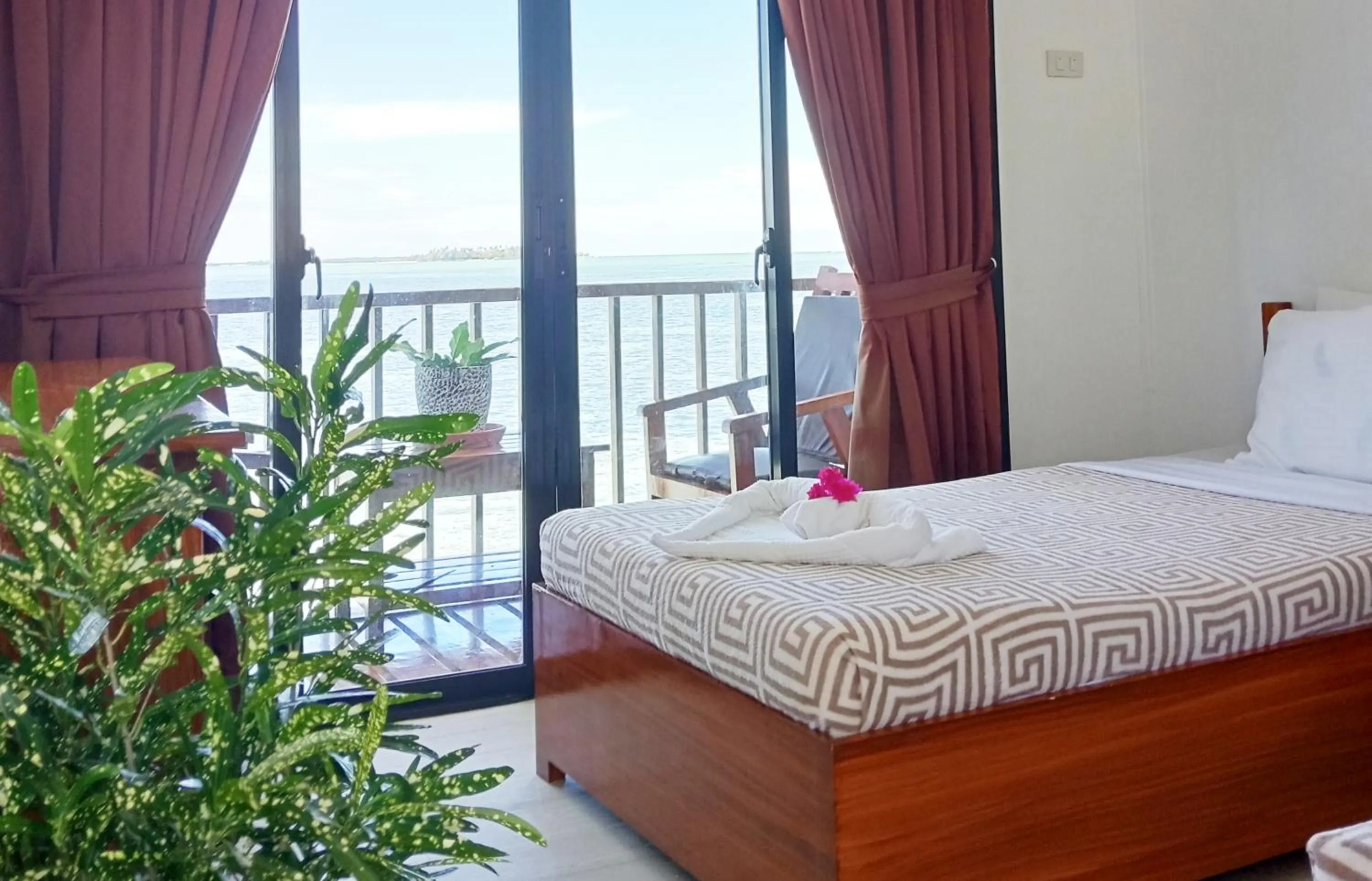 Bed in Nalusuan Island Resort and Marine Sanctuary