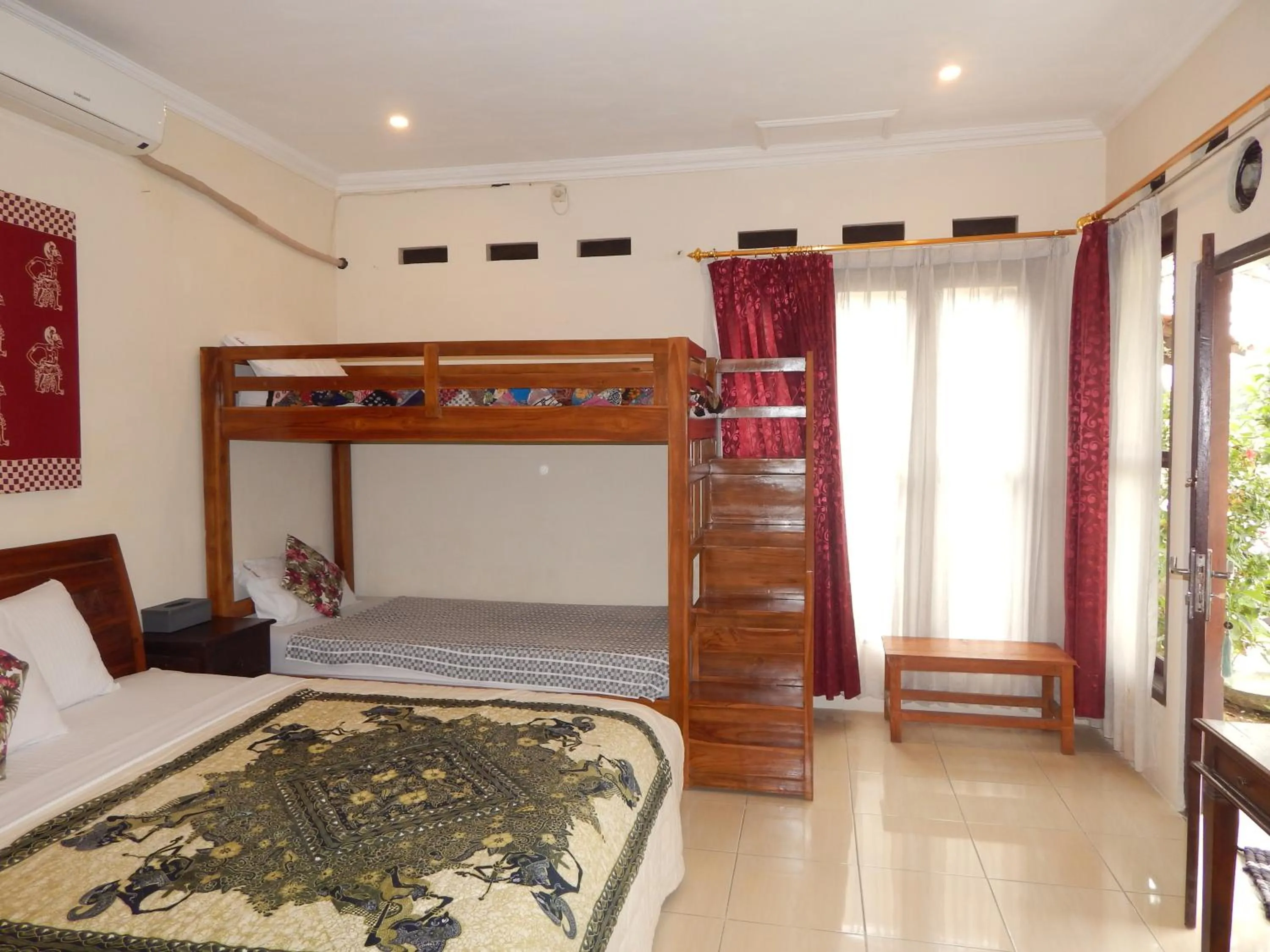 Photo of the whole room, Bed in Rosella Cottages - Homestay - Yogyakarta