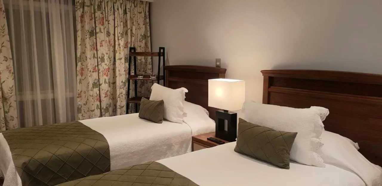 Bed in Hotel Puerta del Lago