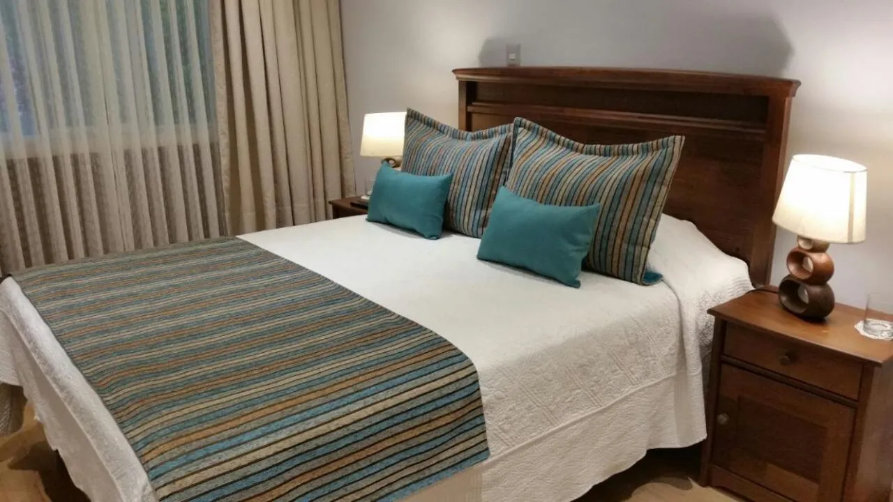 Bed in Hotel Puerta del Lago