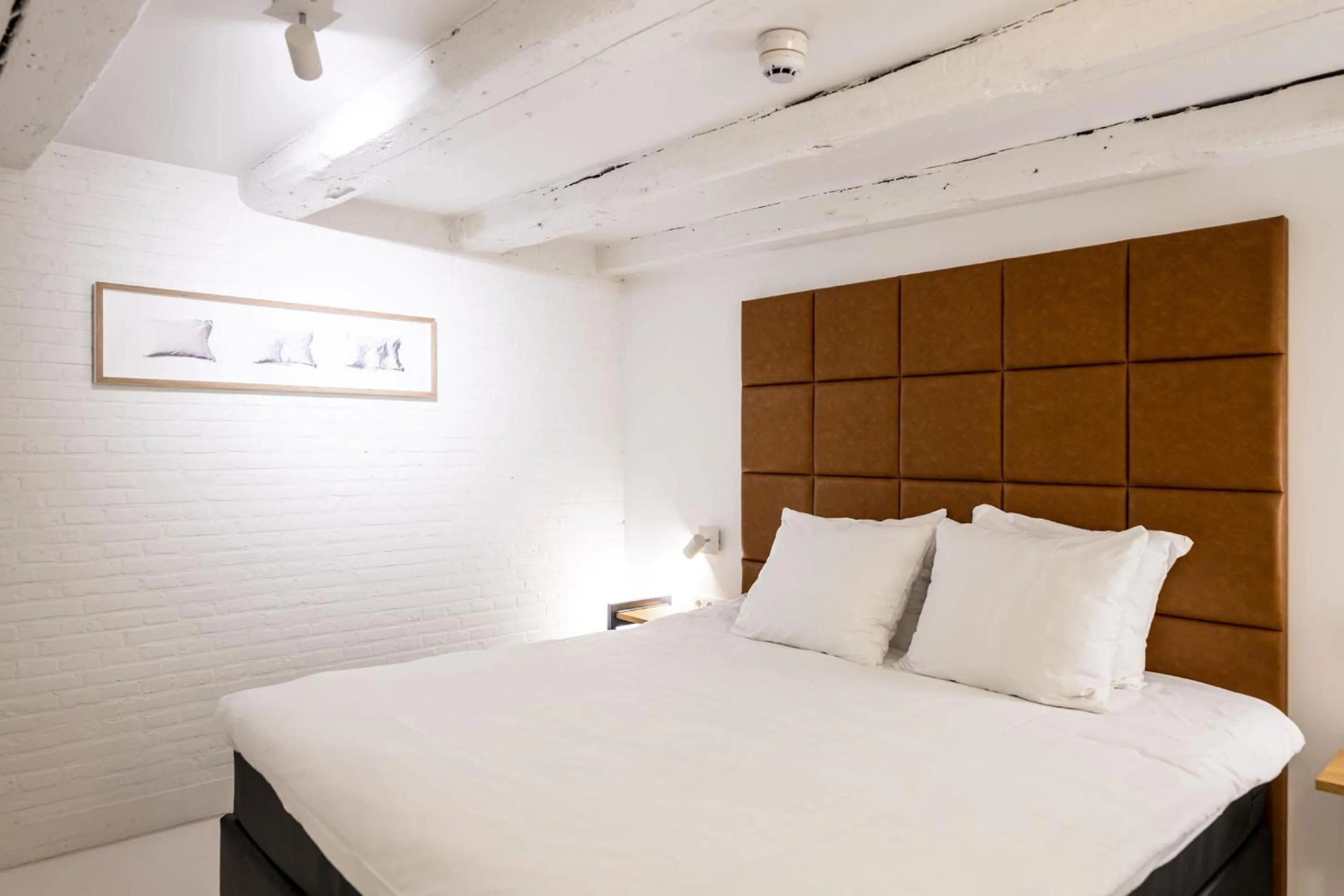 Bed in YAYS Amsterdam Salthouse Canal by Numa