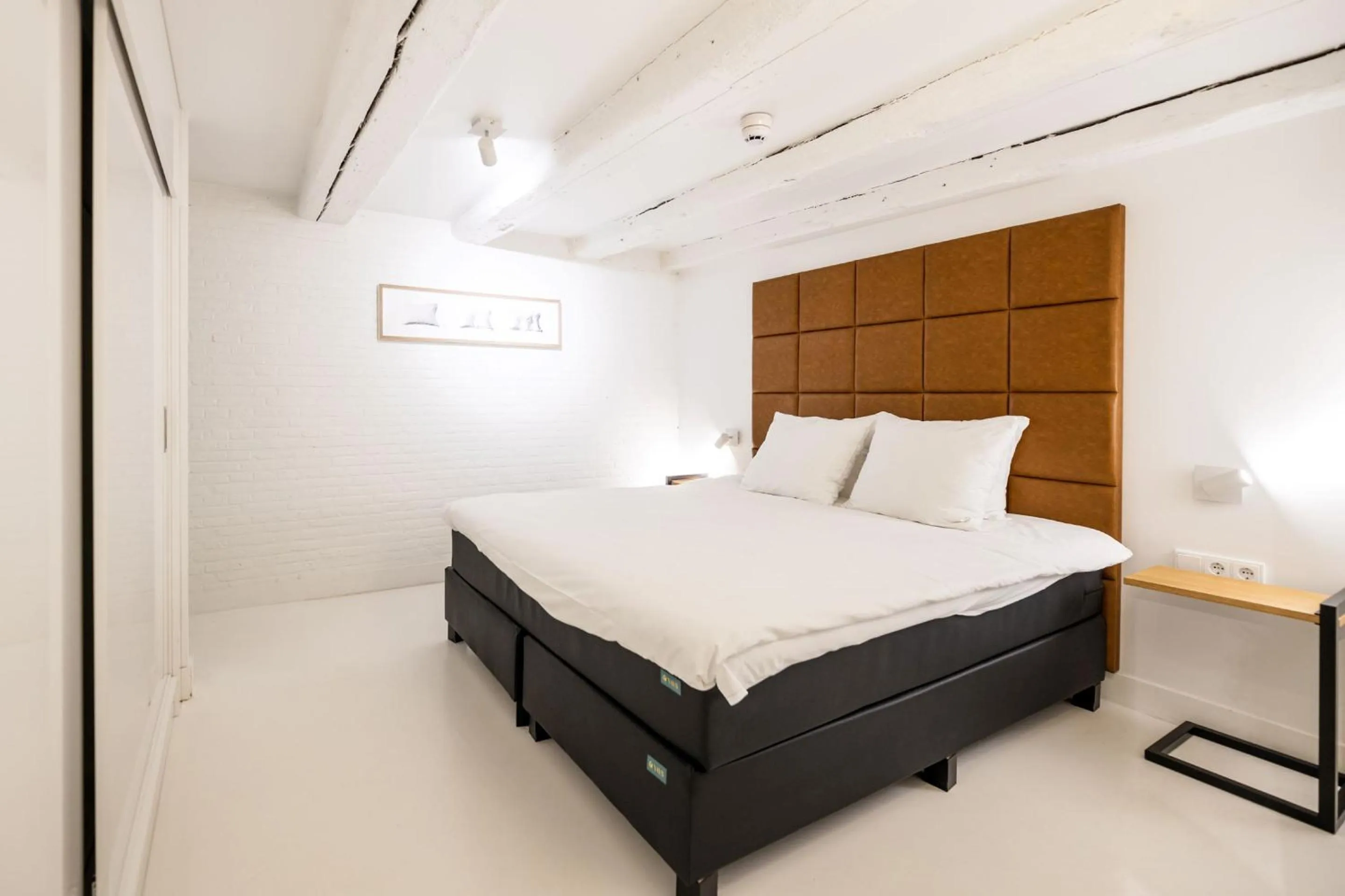 Bed in YAYS Amsterdam Salthouse Canal by Numa