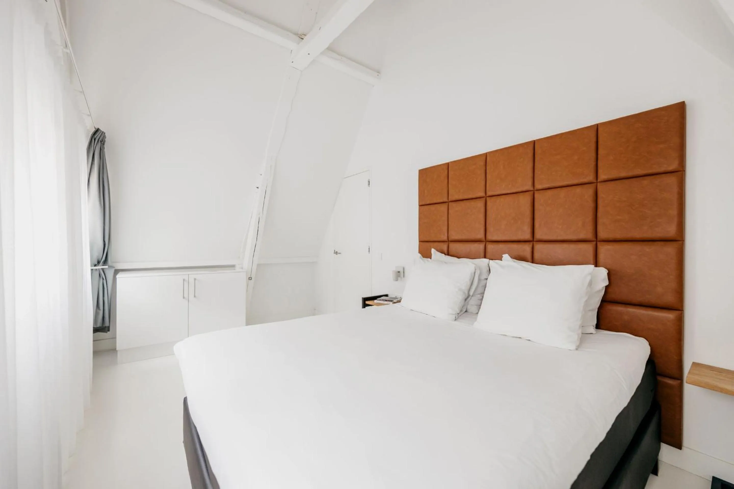 Bed in YAYS Amsterdam Salthouse Canal by Numa